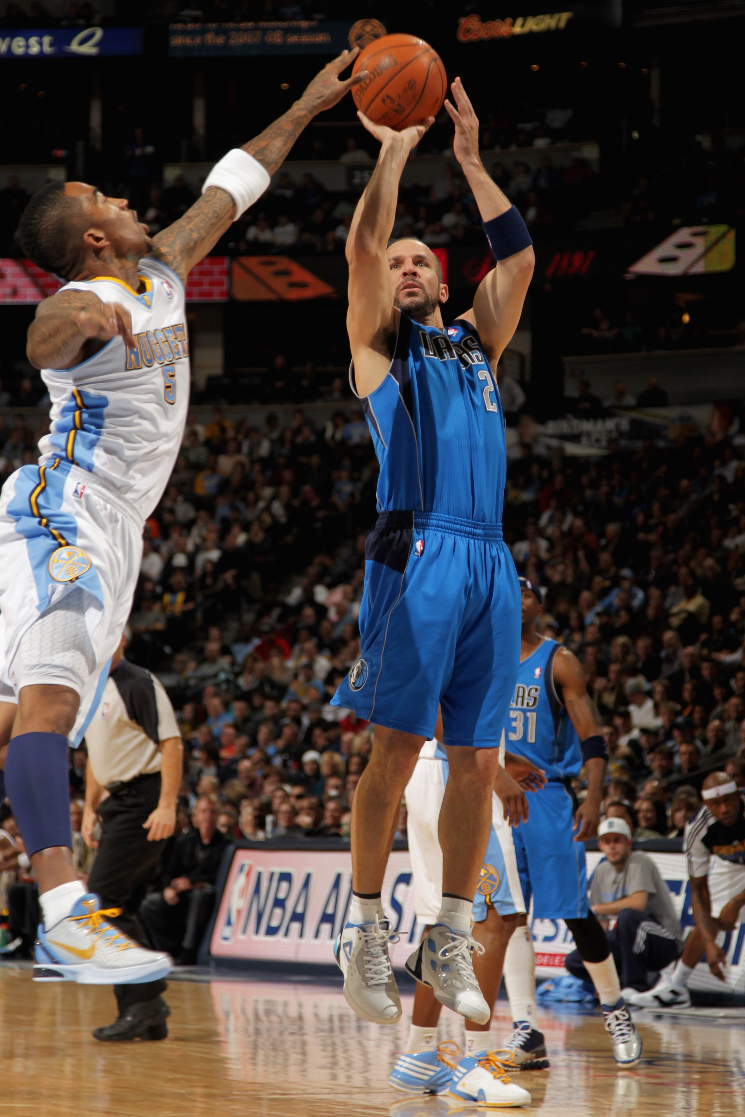 DENVER, CO - FEBRUARY 10:  Jason Kidd #2 of the Dallas Mavericks takes a shot over J.R. Smith #5 of the Denver Nuggets during NBA action at the Pepsi Center on February 10, 2011 in Denver, Colorado. NOTE TO USER: User expressly acknowledges and agrees tha