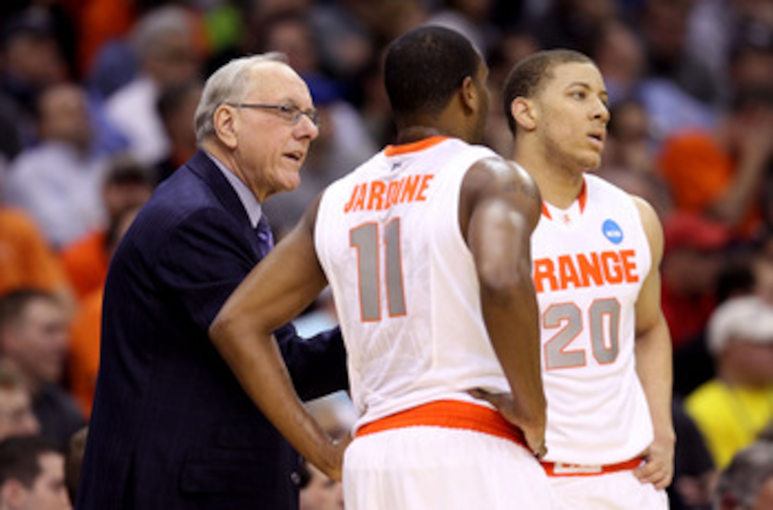 CLEVELAND, OH - MARCH 18: Head coach Jim Boeheim of the Syracuse Orange speaks to Scoop Jardine #11 and Brandon Triche #20 during the game against the Indiana State Sycamores during the second round of the 2011 NCAA men's basketball tournament at Quicken