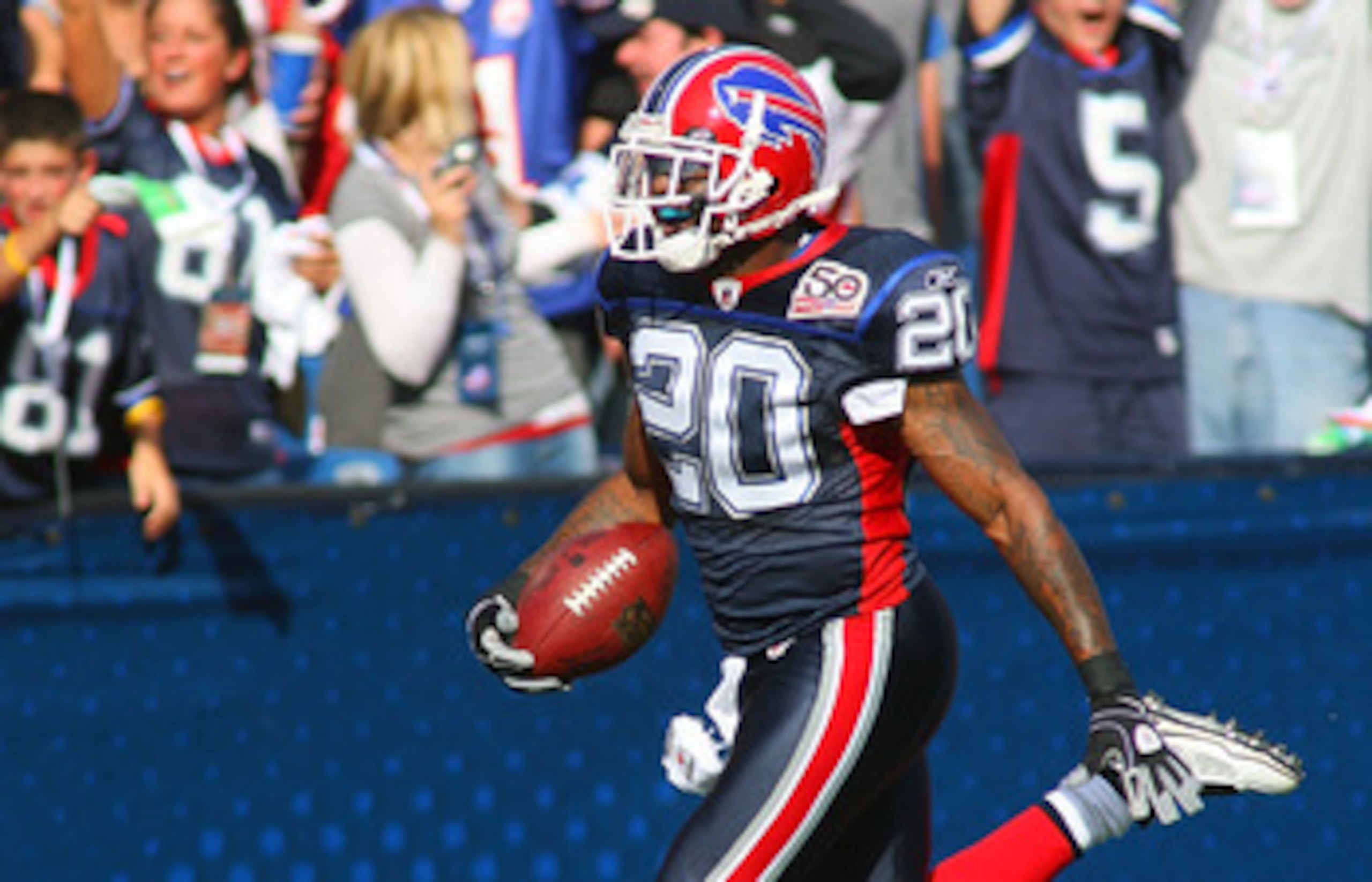 ORCHARD PARK, NY - SEPTEMBER 20:  Donte Whitner #20  of the Buffalo Bills returns an intercepted pass 76  yards for a touchdown against the Tampa Bay Buccaneers at Ralph Wilson Stadium on September 20, 2009 in Orchard Park, New York.  (Photo by Rick Stewa