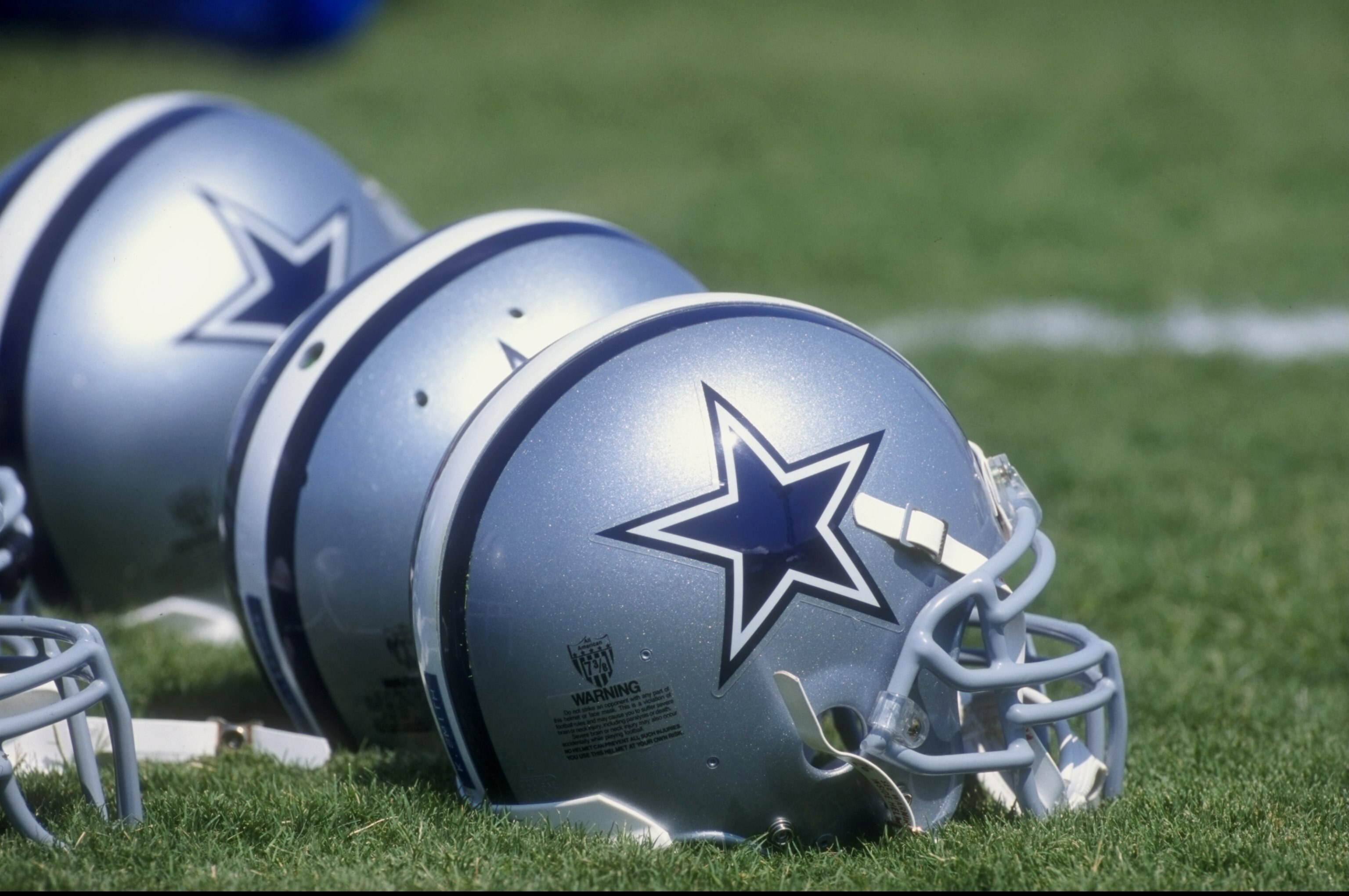 17 Jul 1998:  General view of helmets lined up during the 1998 Dallas Cowboys Training Camp at the Midwestern State University in Wichita Falls, Texas. Mandatory Credit: Stephen Dunn  /Allsport