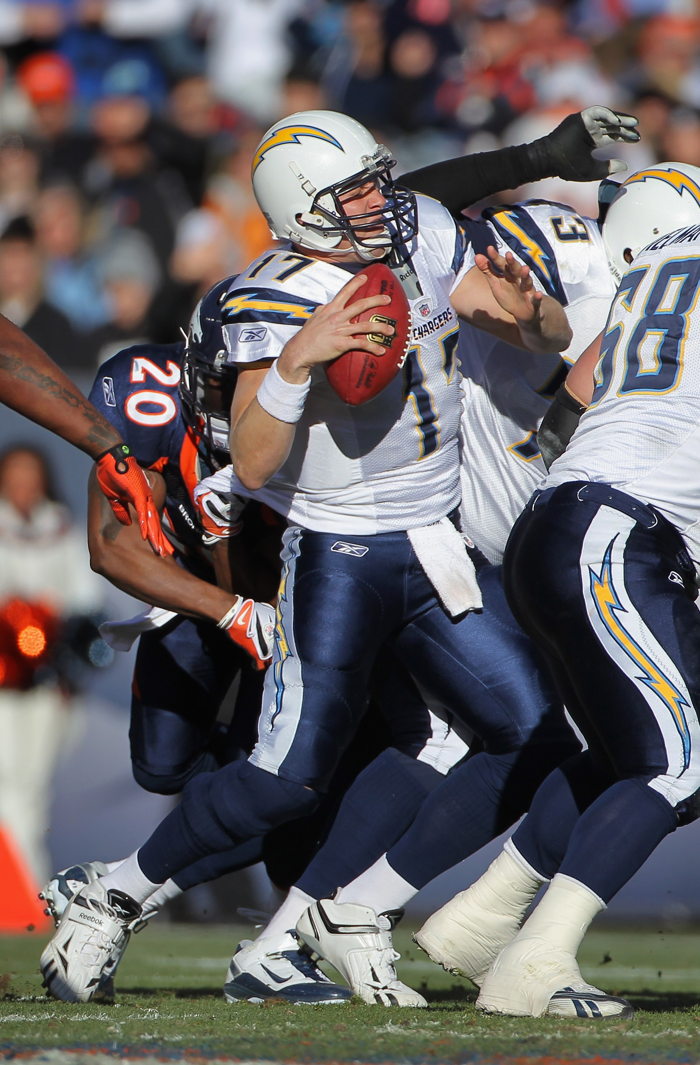 DENVER - JANUARY 02:  Quarterback Philip Rivers #17 of the San Diego Chargers is sacked by Brian Dawkins #20 of the Denver Broncos at INVESCO Field at Mile High on January 2, 2011 in Denver, Colorado.  (Photo by Doug Pensinger/Getty Images)