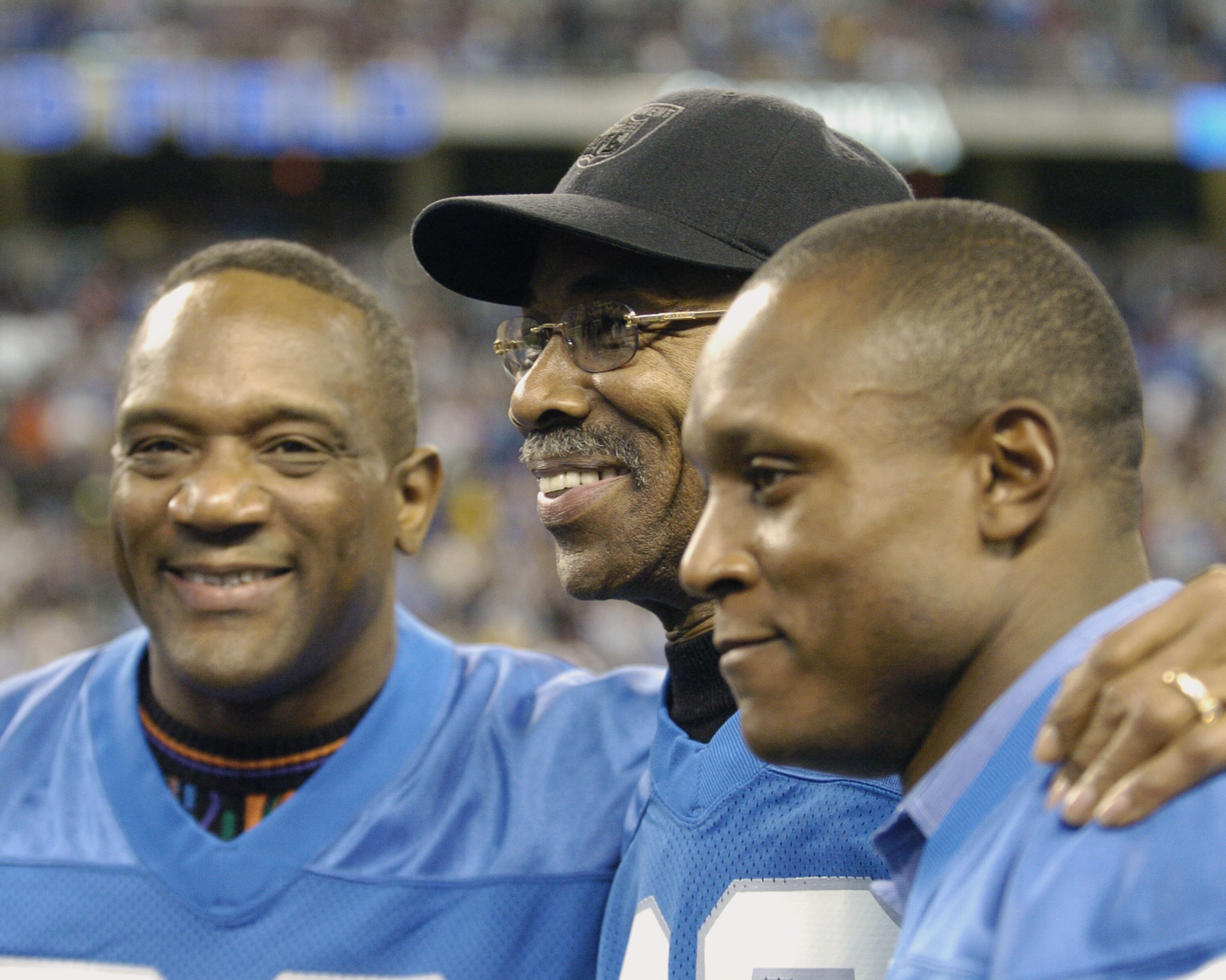Detroit Lions running backs Billy Simms and Barry Sanders flank Lem Barney before play against  the Indianapolis Colts in a Thanksgiving Day game, November 25, 2005 in Detroit.  The Colts defeated the Lions 41 to 9.  (Photo by Al Messerschmidt/Getty Image