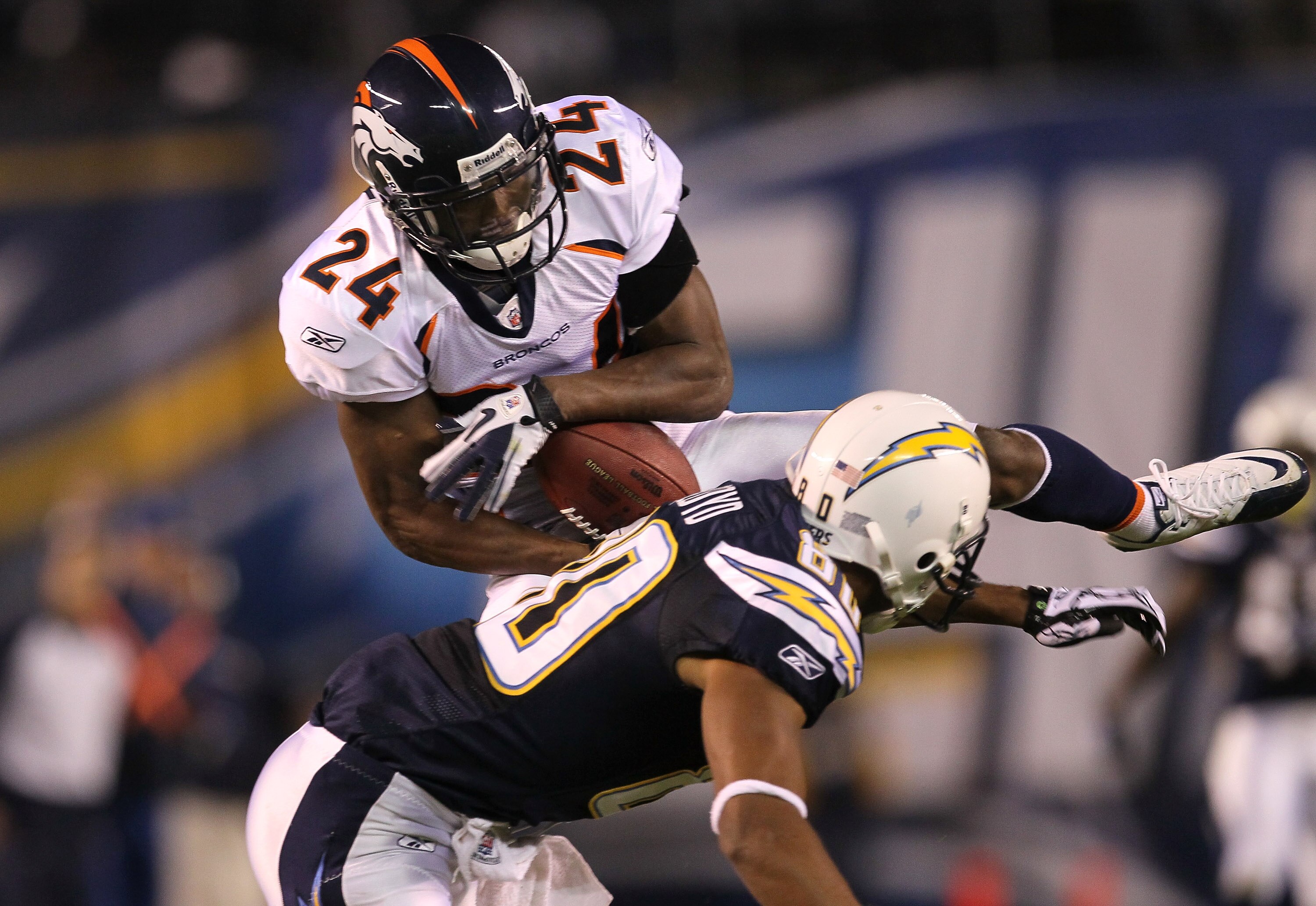 SAN DIEGO - NOVEMBER 22:  Cornerback Champ Bailey #24 of the Denver Broncos intercepts a pass over wide receiver Malcom Floyd #80 of the San Diego Chargers at Qualcomm Stadium on November 22, 2010 in San Diego, California.  (Photo by Stephen Dunn/Getty Im