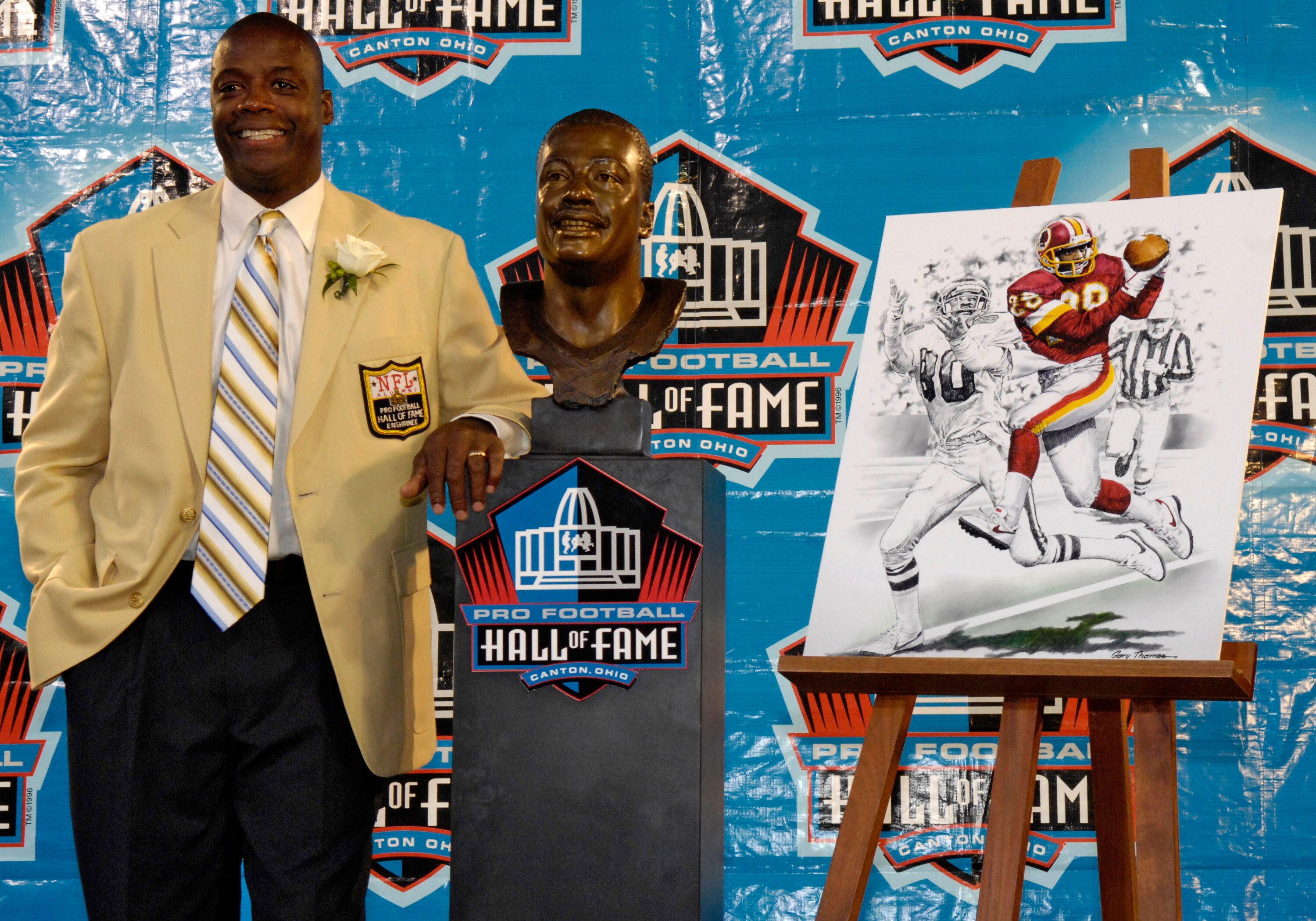 CANTON, OH - AUGUST 2:  Darrell Green formerly of the Washington Redskins  poses with his bust after his induction during the  Class of 2008 Pro Football Hall of Fame Enshrinement Ceremony at Fawcett Stadium on August 2, 2008 in Canton, Ohio.   (Photo by 