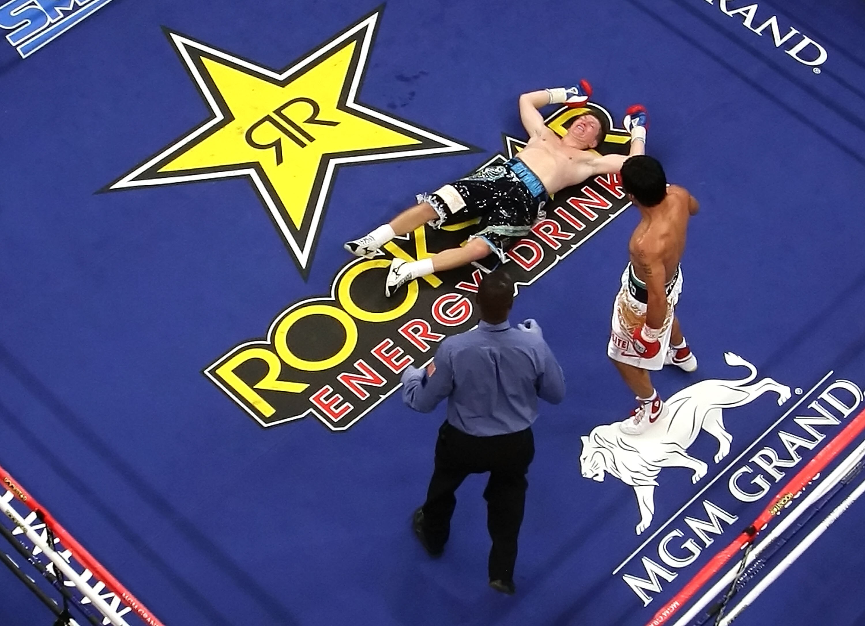 LAS VEGAS - MAY 02:  Manny Pacquiao of the Philippines stands over Ricky Hatton of England after knocking him out in the second round during their junior welterweight title fight at the MGM Grand Garden Arena May 2, 2009 in Las Vegas, Nevada.  (Photo by A