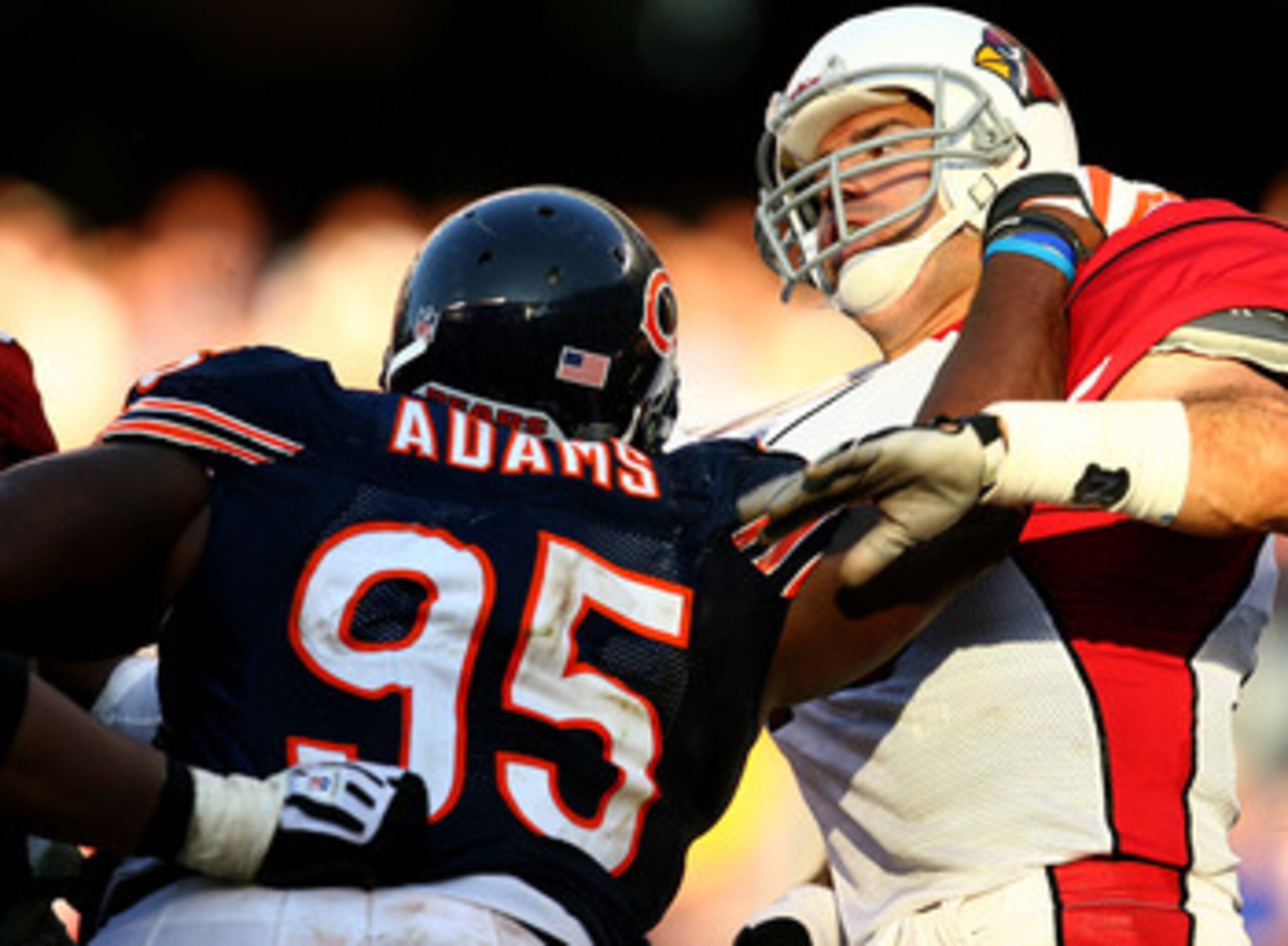 CHICAGO - NOVEMBER 08: Anthony Adams #95 of the Chicago Bears hits Kurt Warner #13 of the Arizona Cardinals at Soldier Field on November 8, 2009 in Chicago, Illinois. The Cardinals defeated the Bears 41-21. (Photo by Jonathan Daniel/Getty Images)