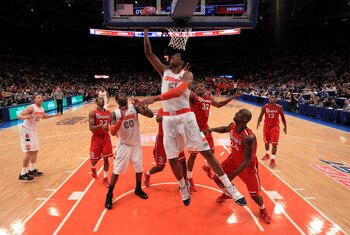 NEW YORK, NY - MARCH 10: Fab Melo #51 of the Syracuse Orange drives to the basket against the St. John's Red Storm during the quarterfinals of the 2011 Big East Men's Basketball Tournament presented by American Eagle Outfitters  at Madison Square Garden o