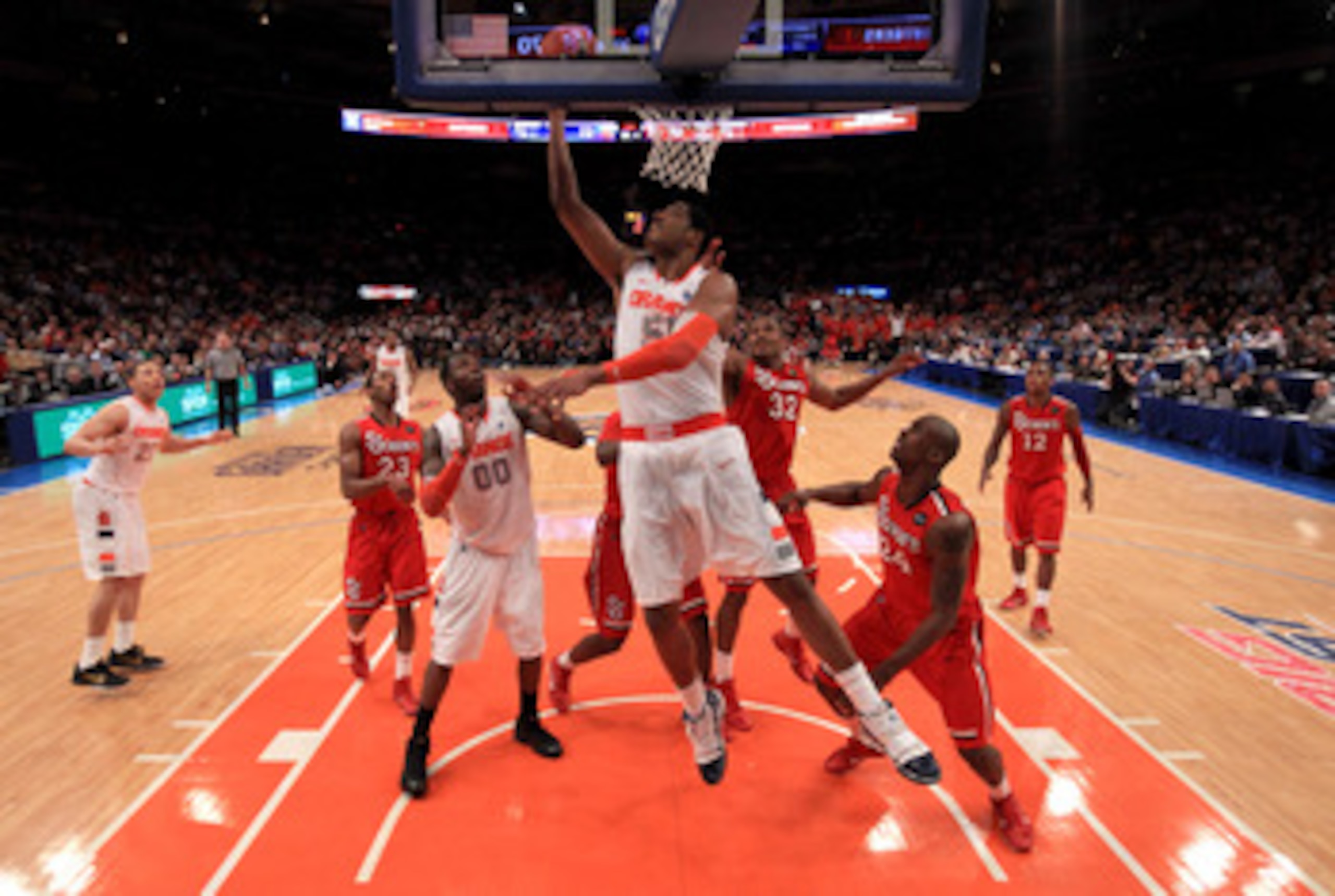 NEW YORK, NY - MARCH 10: Fab Melo #51 of the Syracuse Orange drives to the basket against the St. John's Red Storm during the quarterfinals of the 2011 Big East Men's Basketball Tournament presented by American Eagle Outfitters  at Madison Square Garden o