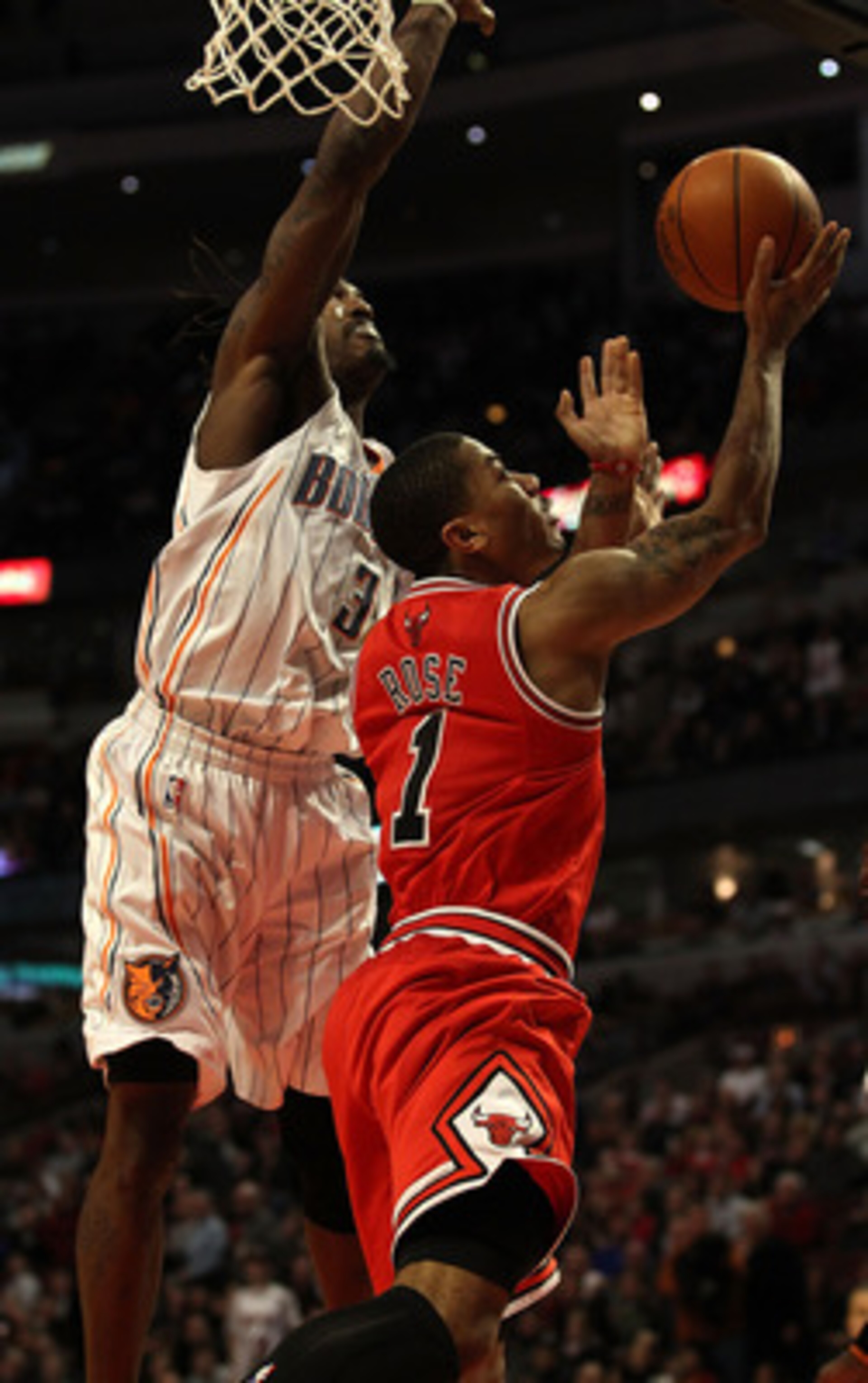CHICAGO, IL - FEBRUARY 15: Derrick Rose #1 of the Chicago Bulls goes up for a shot against Gerald Wallace #3 of the Charlotte Bobcats at the United Center on February 15, 2011 in Chicago, Illinois. The Bulls defeated the Bobcats 106-94. NOTE TO USER: User CHICAGO, IL - FEBRUARY 15: Derrick Rose #1 of the Chicago Bulls goes up for a shot against Gerald Wallace #3 of the Charlotte Bobcats at the United Center on February 15, 2011 in Chicago, Illinois. The Bulls defeated the Bobcats 106-94. NOTE TO USER: User