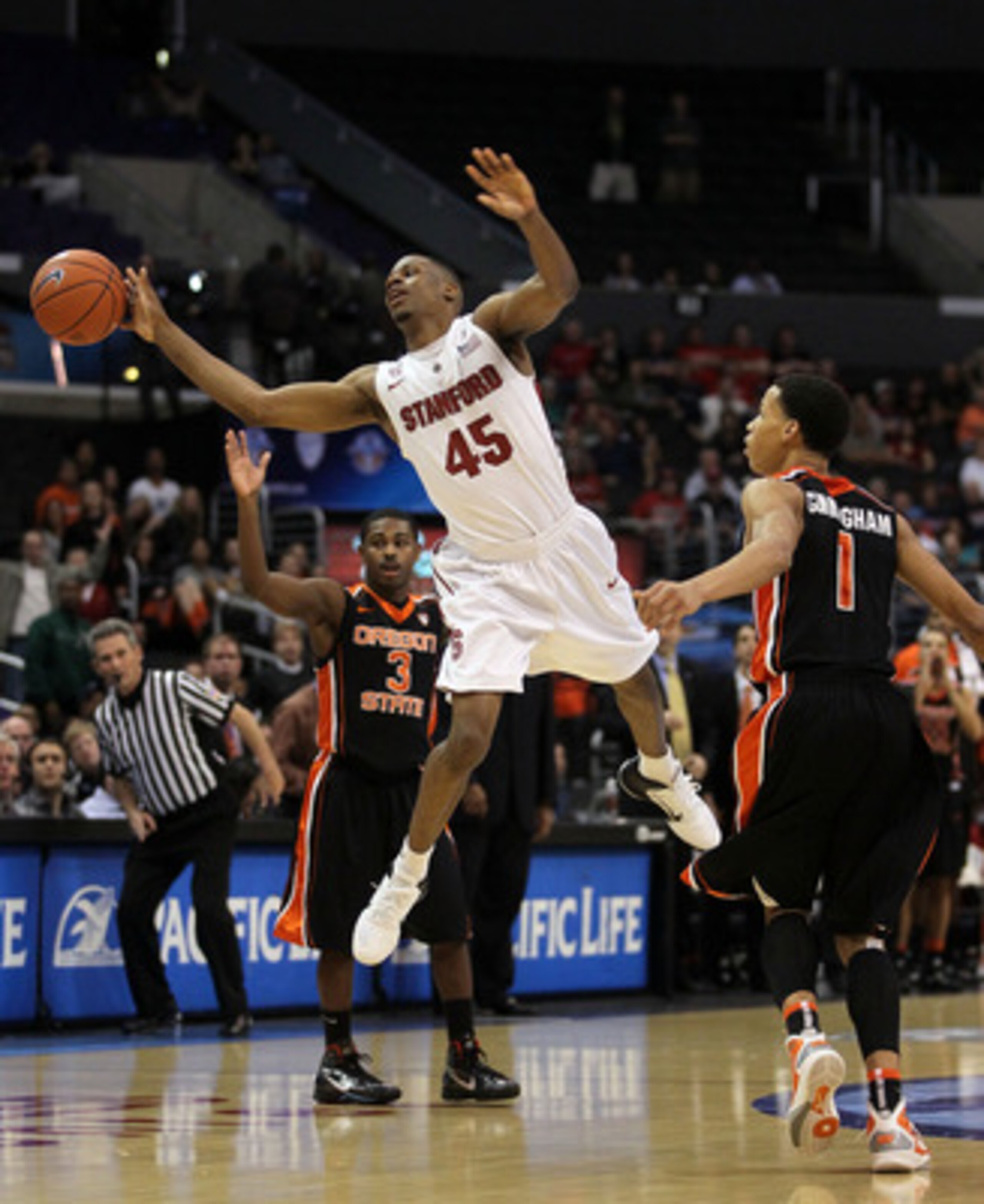 LOS ANGELES, CA - MARCH 09:  Jeremy Green #45 of the Stanford Cardinal has his last second shot attempt blocked by Jared Cunningham #1 of the Oregon State Beavers as the Cardinal lost to the Beavers 69-67 in the first round of the 2011 Pacific Life Pac-10