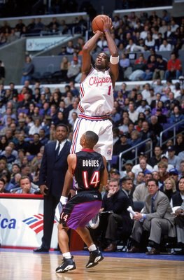 8 Mar 2000:  Derek Anderson #1 of the Los Angeles Clippers jumps to shoot the ball as Muggsy Bogues #14 of the Toronto Raptors watches him during the game at Staples Center in Los Angeles, California. The Raptors defeated the Clippers 95-94.   Mandatory C