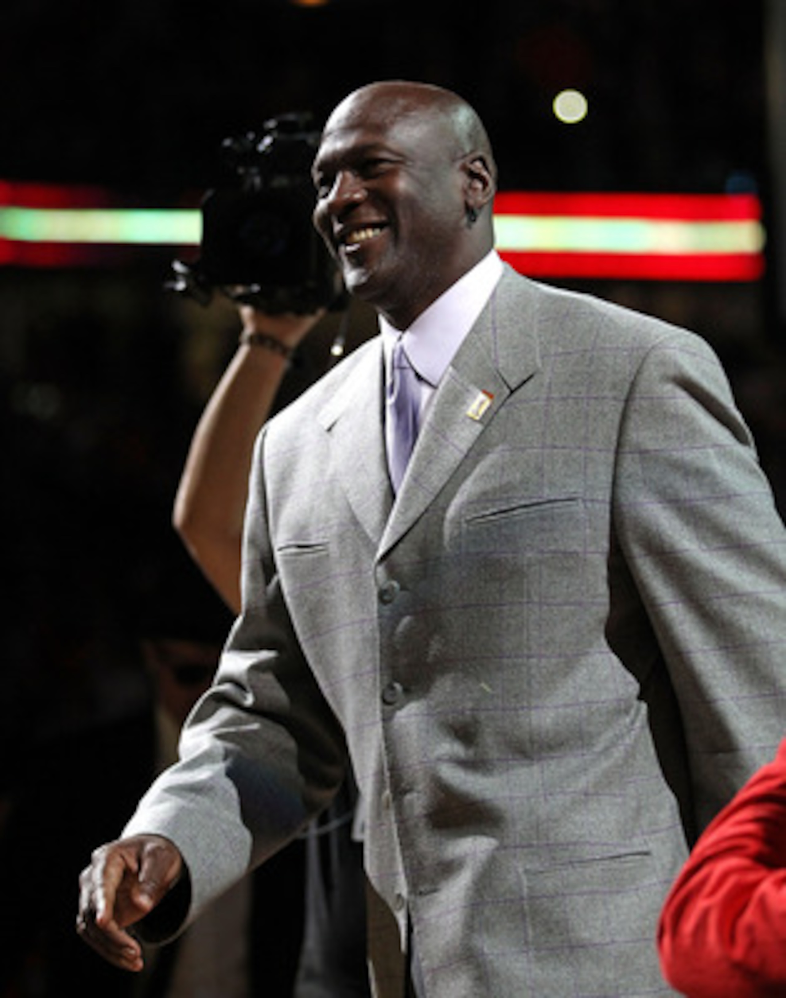 CHICAGO, IL - MARCH 12: Former player Michael Jordan of the Chicago Bulls smiles as he is introduced to the crowd during a 20th anniversary recognition ceremony of the Bulls 1st NBA Championship in 1991 during half-time of a game bewteen the Bulls and th CHICAGO, IL - MARCH 12: Former player Michael Jordan of the Chicago Bulls smiles as he is introduced to the crowd during a 20th anniversary recognition ceremony of the Bulls 1st NBA Championship in 1991 during half-time of a game bewteen the Bulls and th