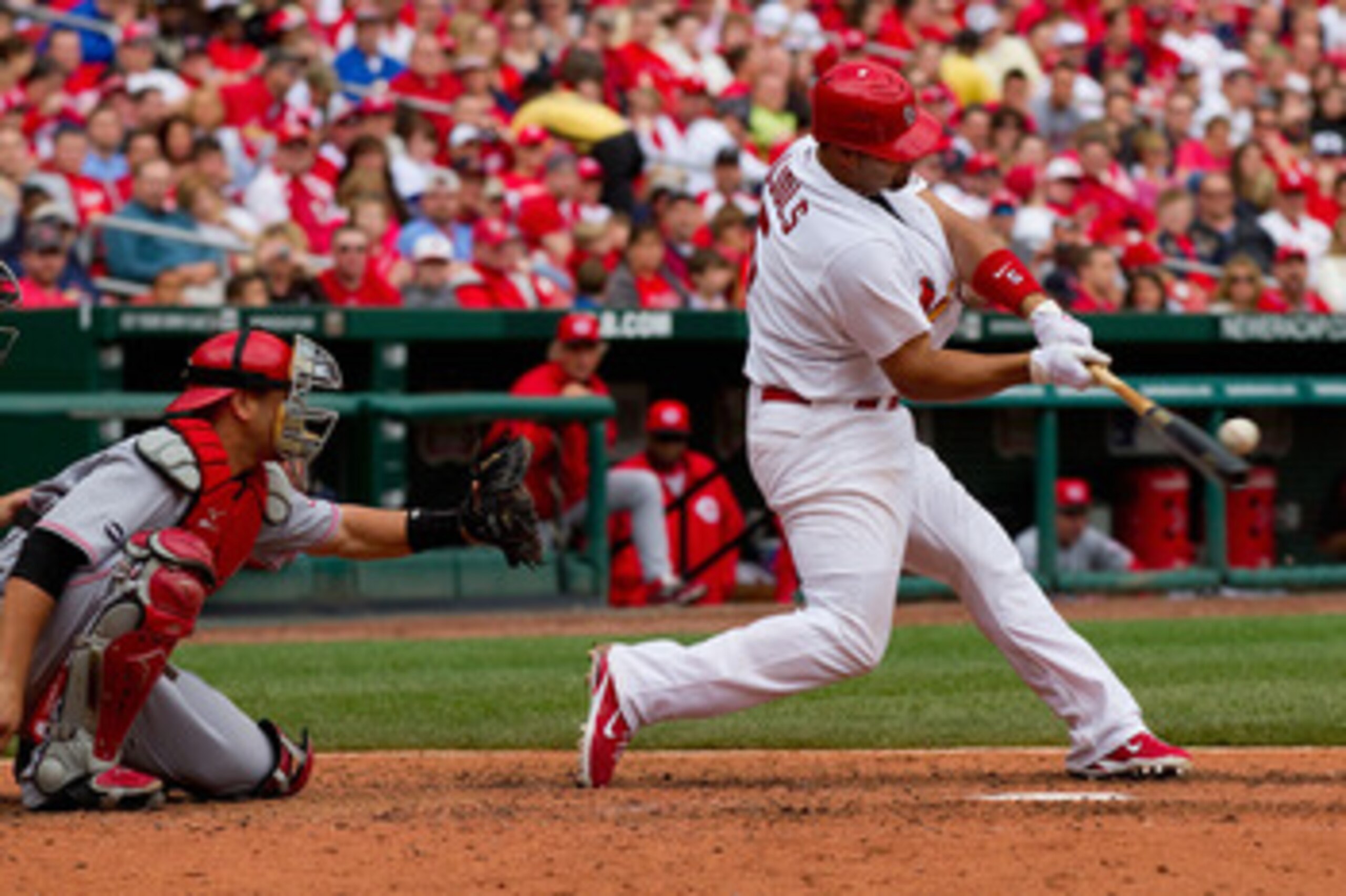 ST. LOUIS, MO - APRIL 23: Albert Pujols #5 of the St. Louis Cardinals hits a two-run home run against the Cincinnati Reds at Busch Stadium on April 23, 2011 in St. Louis, Missouri.  (Photo by Dilip Vishwanat/Getty Images)