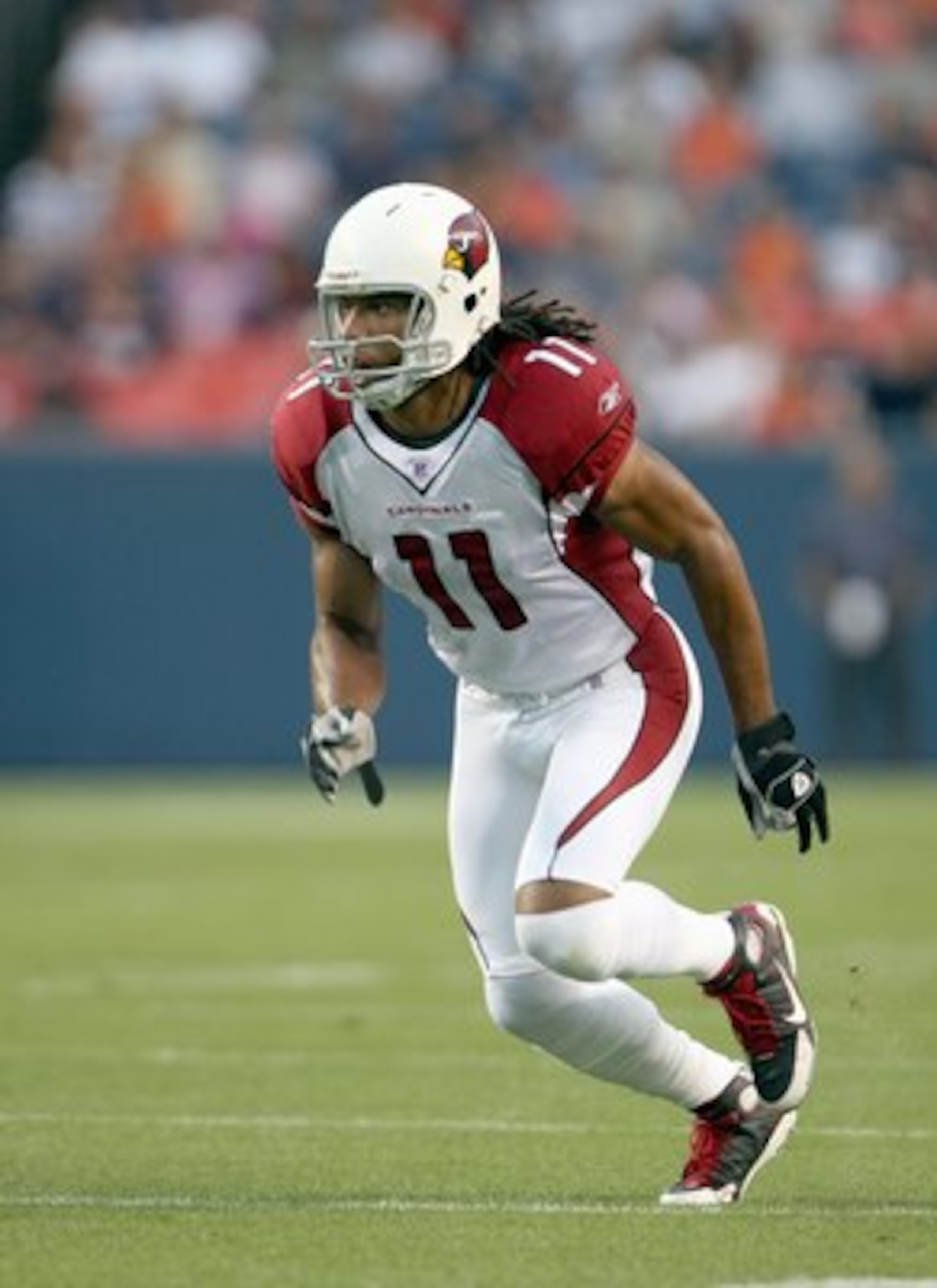 DENVER - AUGUST 30: Larry Fitzgerald #11 of the Arizona Cardinals runs upfield during the NFL preseason game against the Denver Broncos at Invesco Field on August 30, 2007 in Denver, Colorado. (Photo by Doug Pensinger/Getty Images)
