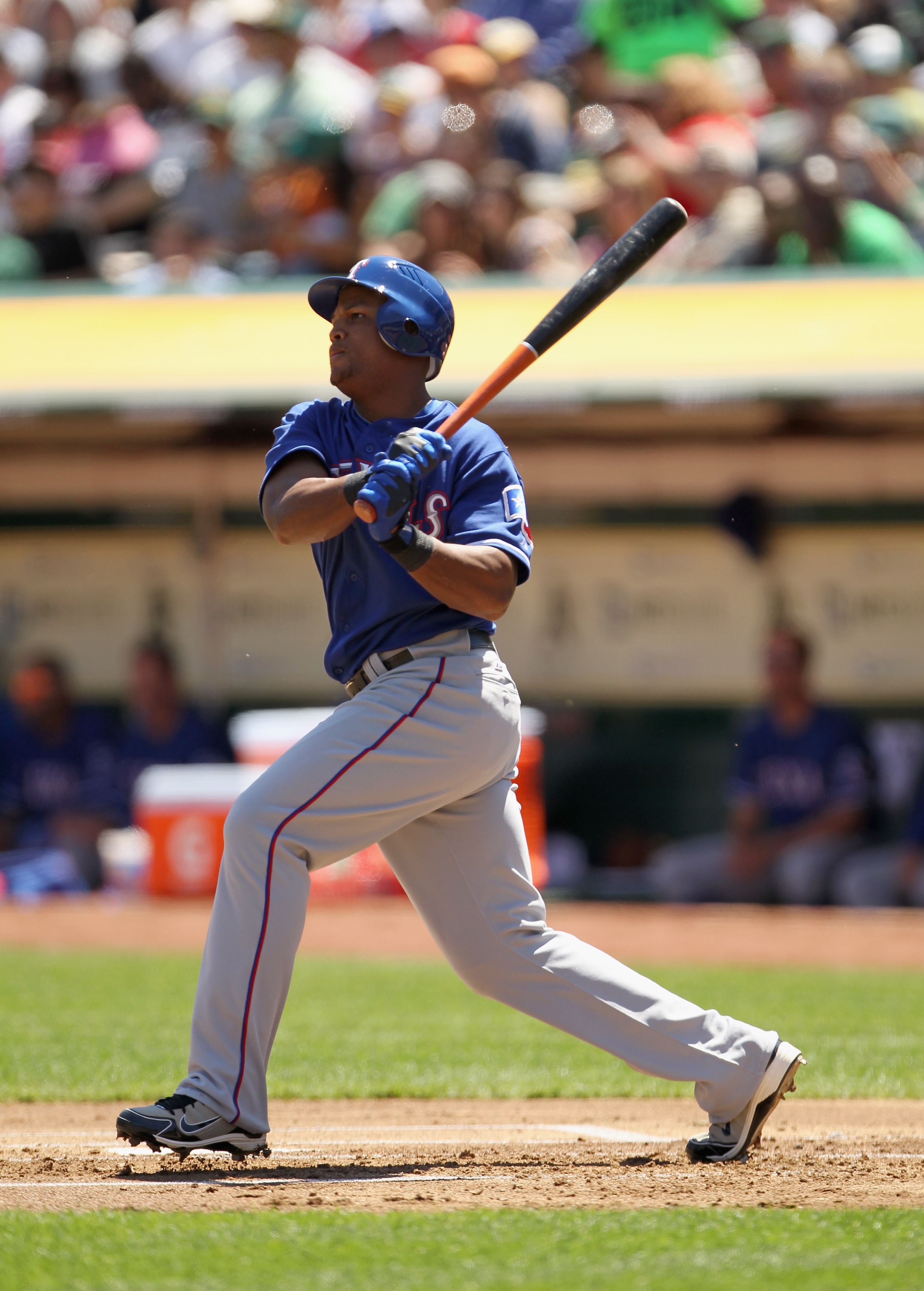OAKLAND, CA - APRIL 30:  Adrian Beltre #29 of the Texas Rangers hits a double that scored Elvis Andrus #1 of the Texas Rangers in the first inning against the Oakland Athletics at Oakland-Alameda County Coliseum on April 30, 2011 in Oakland, California.