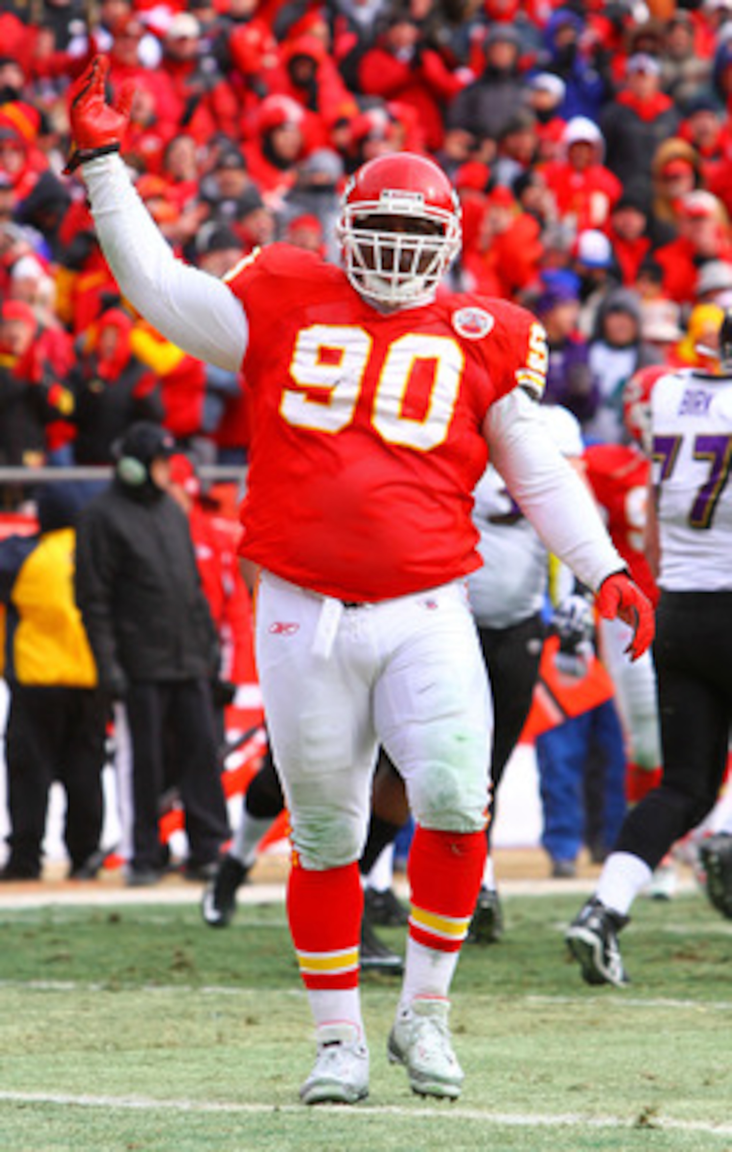 KANSAS CITY, MO - JANUARY 09:  Defensive tackle Shaun Smith #90 of the Kansas City Chiefs reacts against the Baltimore Ravens in the 2011 AFC wild card playoff game at Arrowhead Stadium on January 9, 2011 in Kansas City, Missouri.  (Photo by Dilip Vishwan