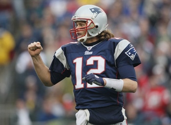 FOXBORO, MA - JANUARY 02:  Tom Brady #12 of the New England Patriots celebrates a touchdown by teammate BenJarvis Green-Ellis in the first quarter against the Miami Dolphins on January 2, 2011 at Gillette Stadium in Foxboro, Massachusetts.  (Photo by Elsa