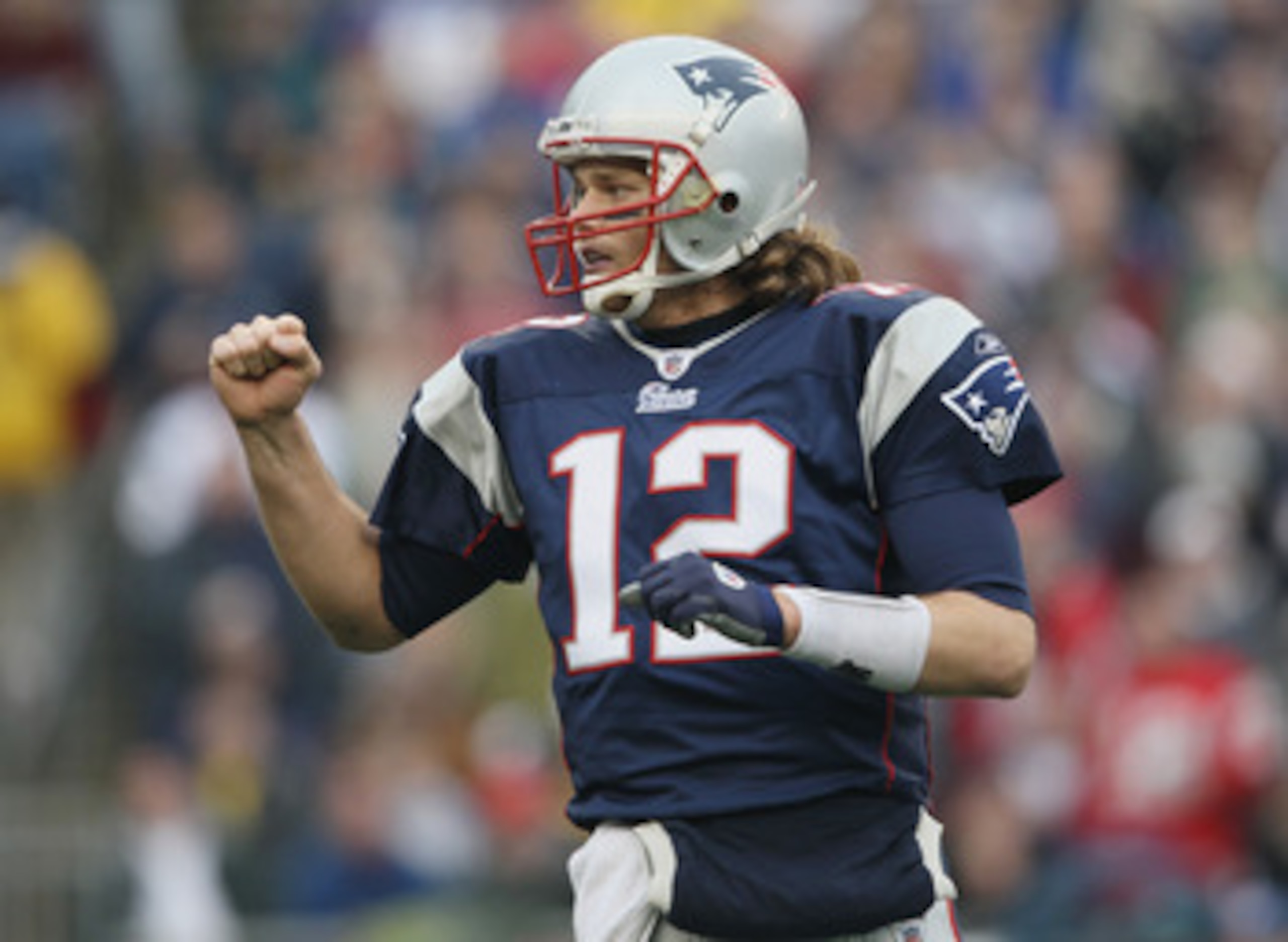 FOXBORO, MA - JANUARY 02:  Tom Brady #12 of the New England Patriots celebrates a touchdown by teammate BenJarvis Green-Ellis in the first quarter against the Miami Dolphins on January 2, 2011 at Gillette Stadium in Foxboro, Massachusetts.  (Photo by Elsa