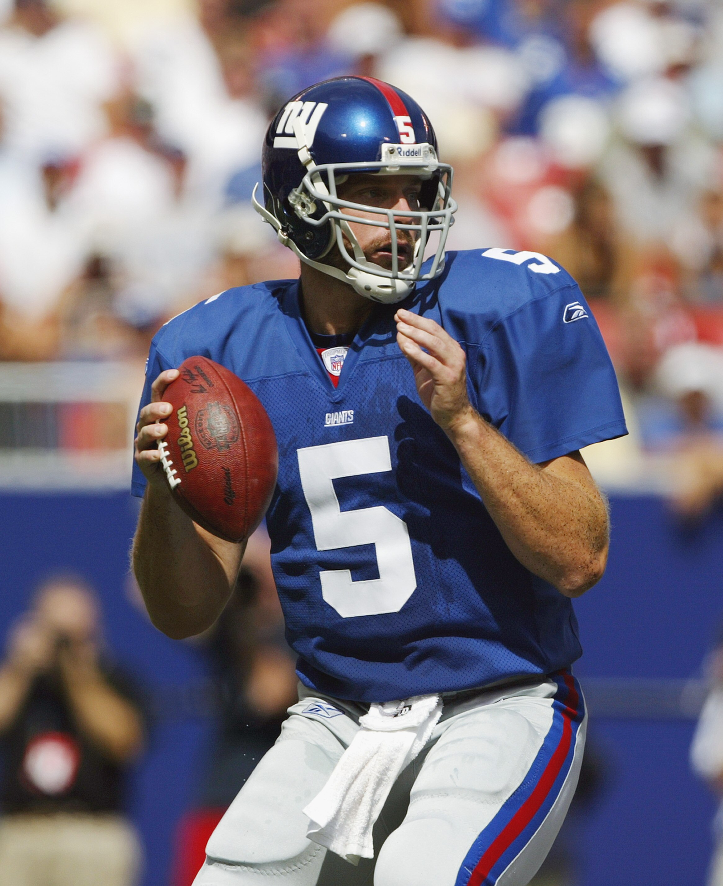 EAST RUTHERFORD, NJ - SEPTEMBER 7:  Quarterback Kerry Collins #5 of the New York Giants drops back to pass during the game against the St. Louis Rams at Giants Stadium on September 7, 2003 in East Rutherford, New Jersey.  The Giants won 23-13.  (Photo by