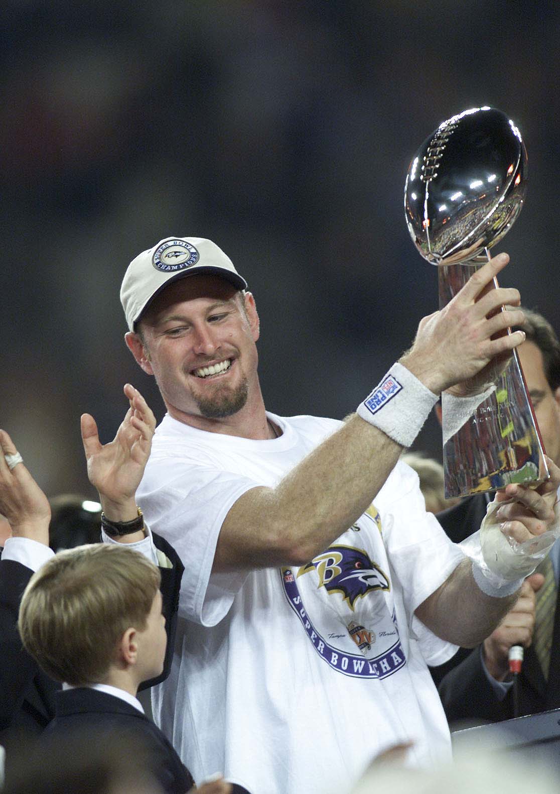 28 Jan 2001: Trent Dilfer of the Baltimore Ravens is presented the Lombardi Trophy after defeating the New York Giants during Super Bowl XXXV at Raymond James Stadium in Tampa, Florida. The Ravens defeated the Giants 34-7. DIGITAL IMAGE. Mandatory Credit: