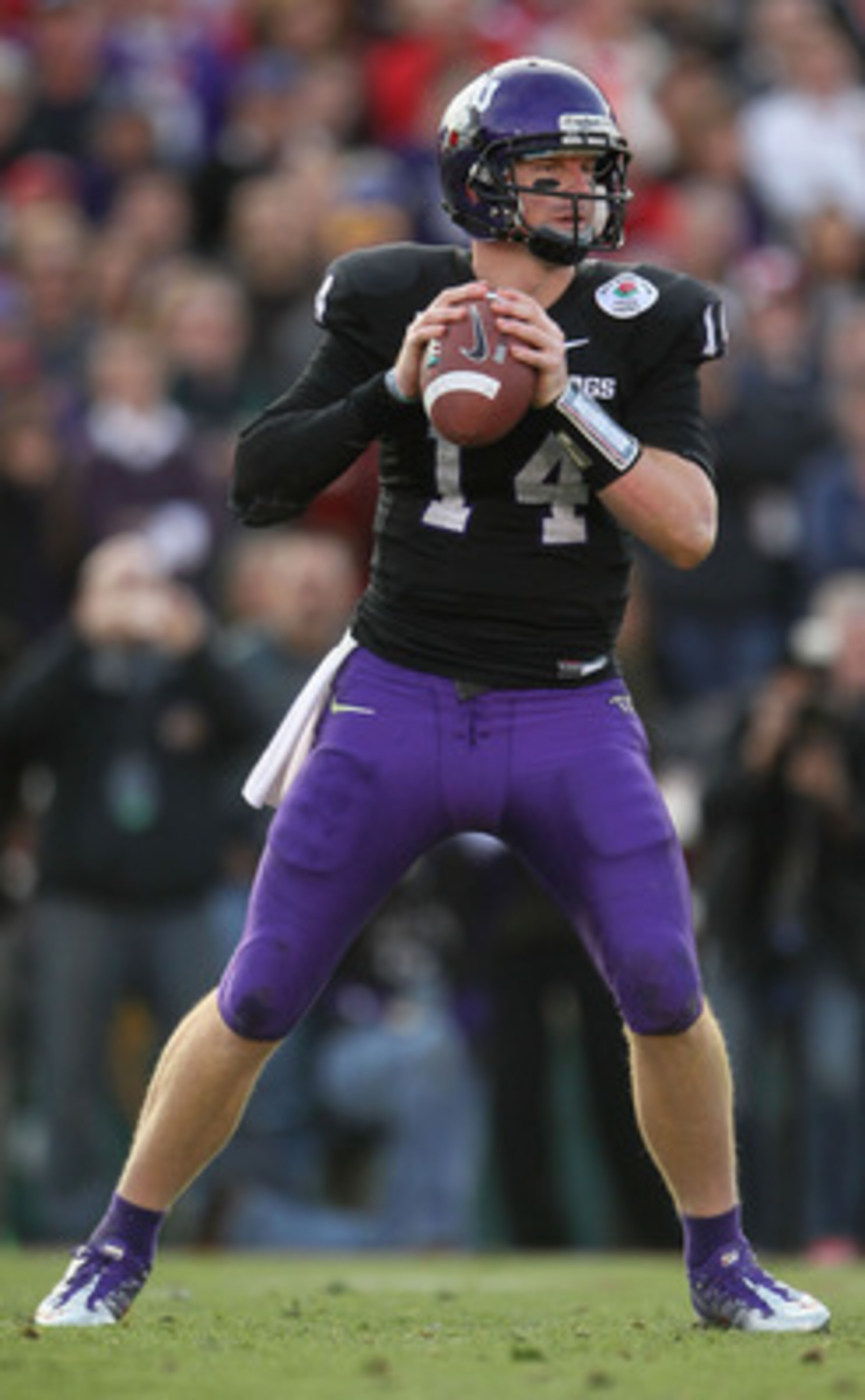 PASADENA, CA - JANUARY 01:  Quarterback Andy Dalton #14 of the TCU Horned Frogs looks to pass against the Wisconsin Badgers in the 97th Rose Bowl game on January 1, 2011 in Pasadena, California.  (Photo by Jeff Gross/Getty Images)