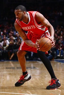 NEW YORK - JANUARY 26:  Tracy McGrady #1 of the Houston Rockets drives against the New York Knicks on January 26, 2009 at Madison Square Garden in New York City.  NOTE TO USER: User expressly acknowledges and agrees that, by downloading and/or using this 