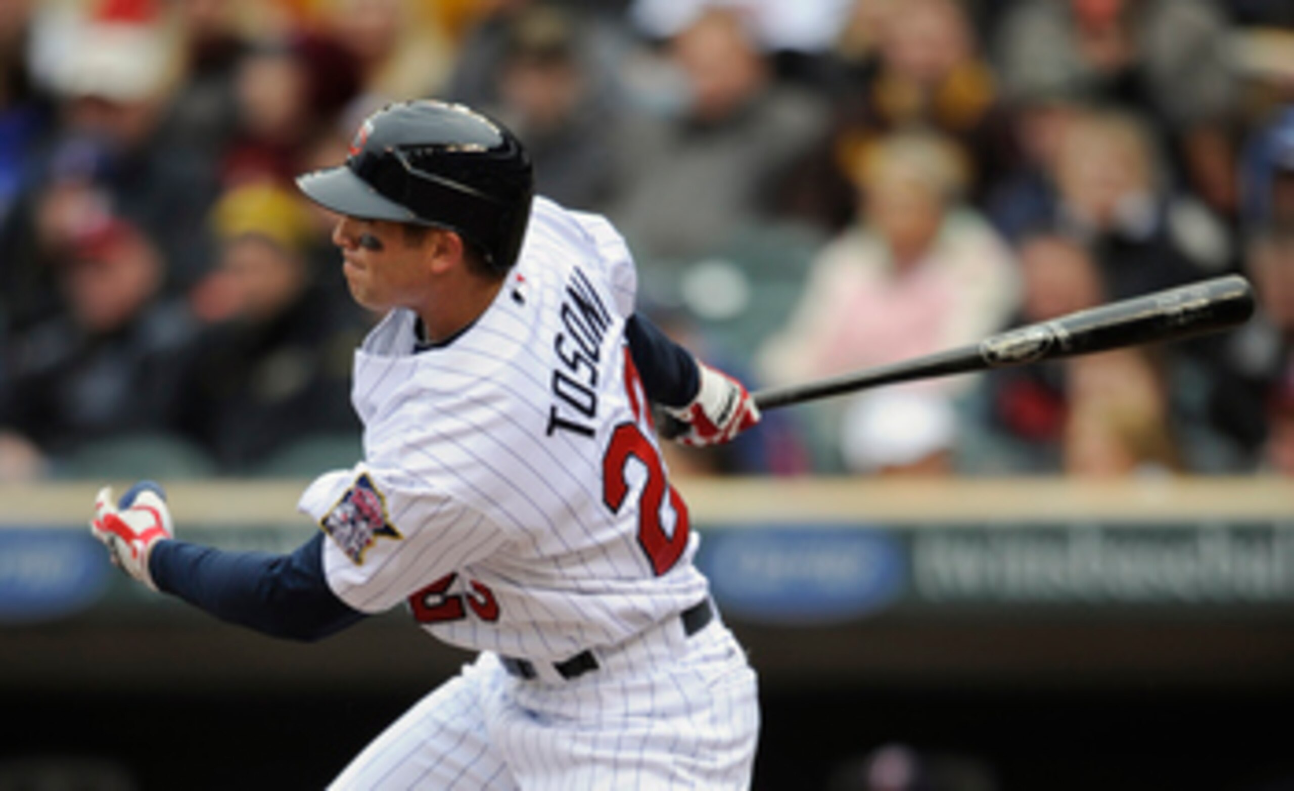MINNEAPOLIS, MN - APRIL 28: Rene Tosoni #23 of the Minnesota Twins hits a single in his first major league at bat against the Tampa Bay Rays during in the third inning of their game on April 28, 2011 at Target Field in Minneapolis, Minnesota. (Photo by Ha