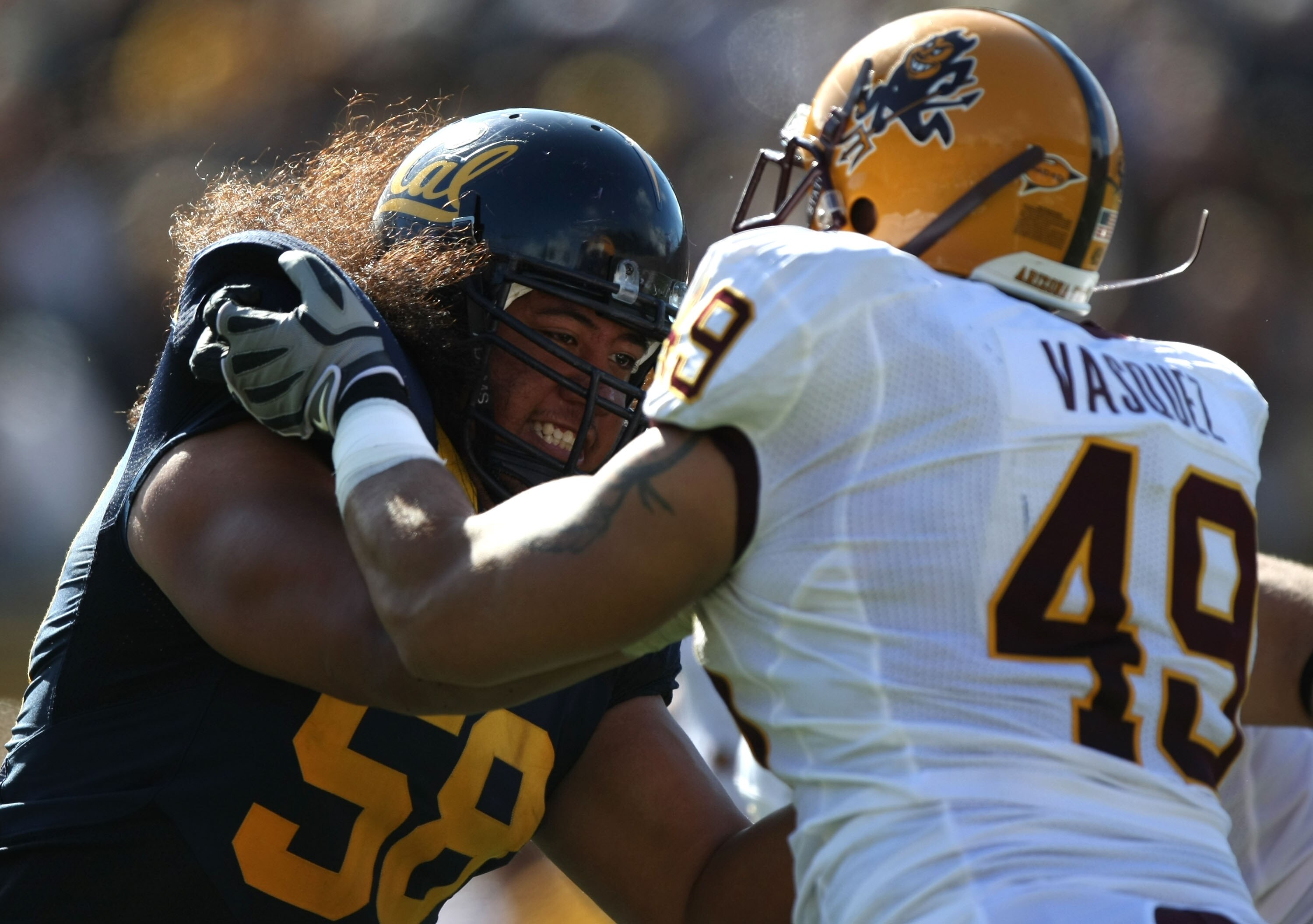 BERKELEY, CA - OCTOBER 04:  Luis Vazquez #49 of the Arizona State Sun Devils battles with Chet Teofilo #58 of the California Golden Bears during an NCAA football game at Memorial Stadium on October 4, 2008 in Berkeley, California.  (Photo by Jed Jacobsohn