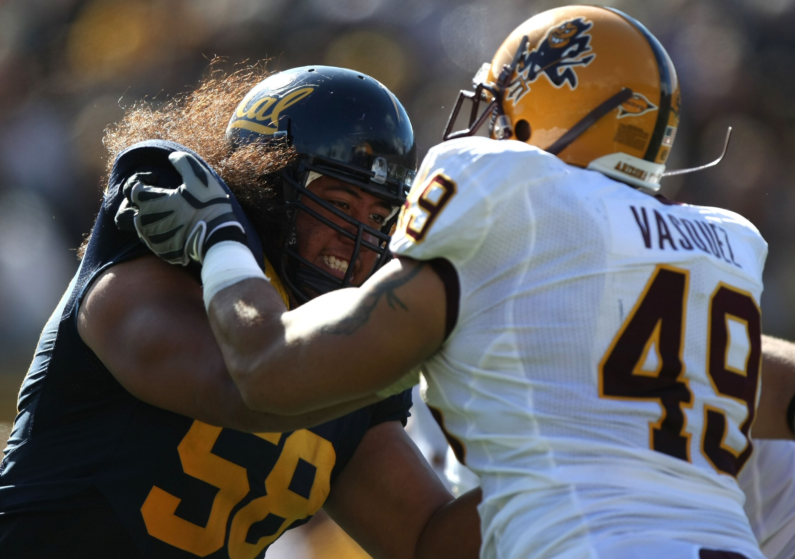 BERKELEY, CA - OCTOBER 04:  Luis Vazquez #49 of the Arizona State Sun Devils battles with Chet Teofilo #58 of the California Golden Bears during an NCAA football game at Memorial Stadium on October 4, 2008 in Berkeley, California.  (Photo by Jed Jacobsohn