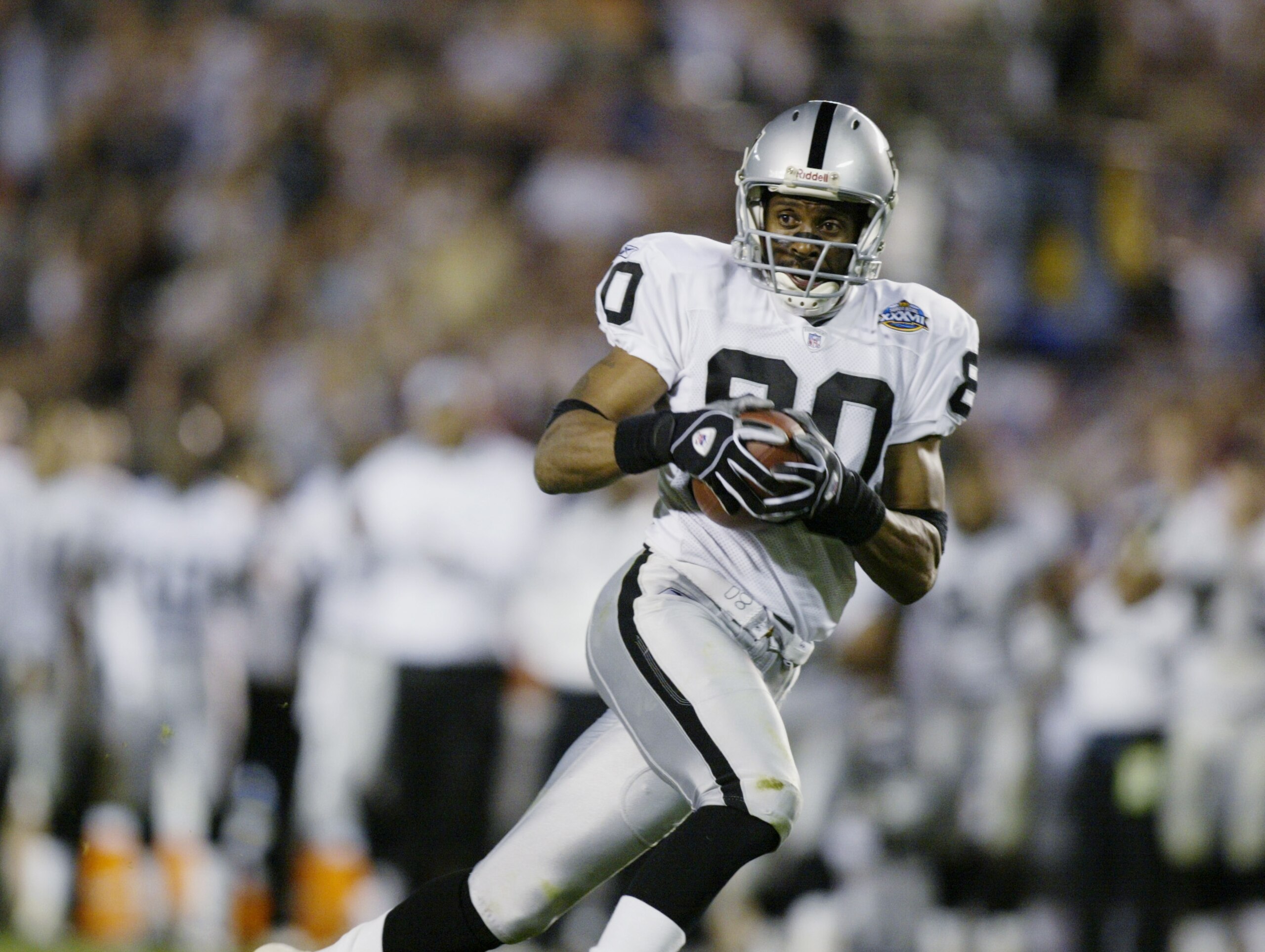 SAN DIEGO - JANUARY 26:  Wide receiver Jerry Rice #80 of the Oakland Raiders carries the ball against the Tampa Bay Buccaneers during Super Bowl XXXVII at Qualcomm Stadium on January 26, 2003 in San Diego, California.  The Buccaneers won 48-21.  (Photo by