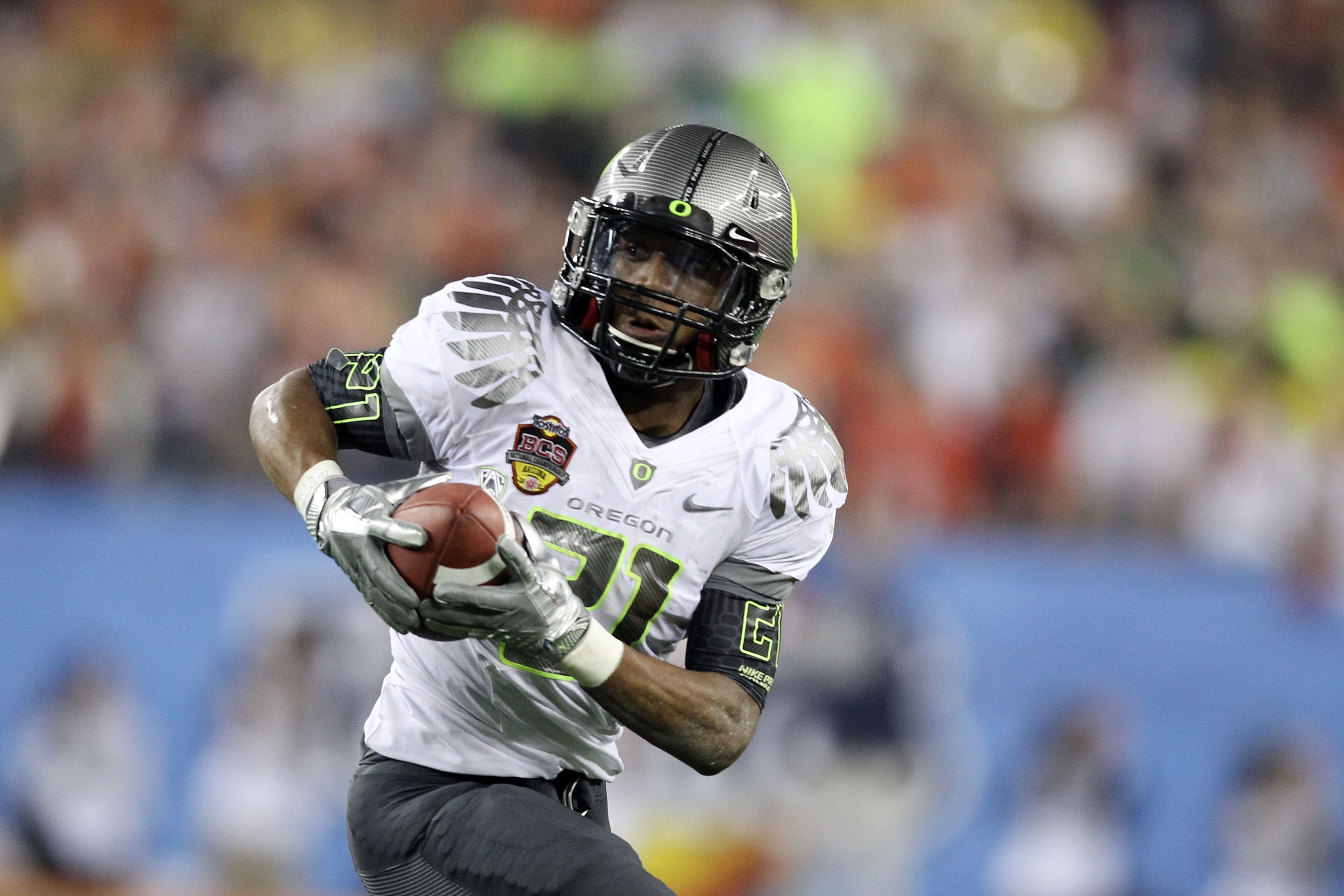 GLENDALE, AZ - JANUARY 10:  LaMichael James #21 of the Oregon Ducks runs down field against the Auburn Tigers during the Tostitos BCS National Championship Game at University of Phoenix Stadium on January 10, 2011 in Glendale, Arizona.  (Photo by Christia