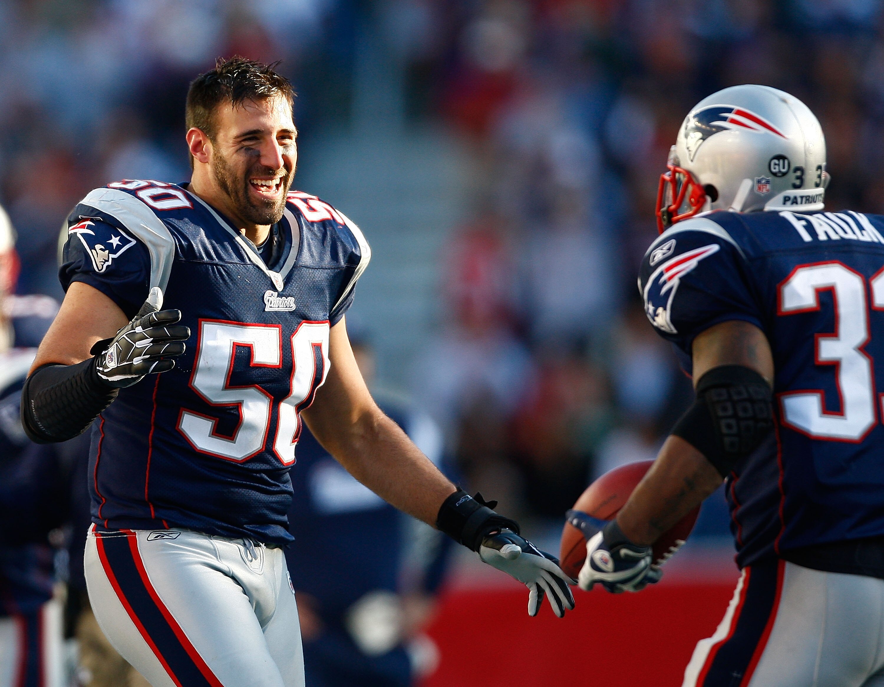FOXBORO, MA - OCTOBER 26: Mike Vrabel #50 celebrates with teammate Kevin Faulk #33 of the New England Patriots, who caught a touchdown pass in the fourth quarter, against the St. Louis Rams at Gillette Stadium on October 26, 2008 in Foxboro, Massachusetts