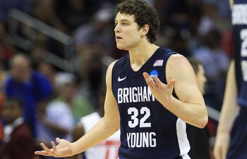 NEW ORLEANS, LA - MARCH 24:  Jimmer Fredette #32 of the Brigham Young Cougars reacts after being injured during their game against the Florida Gators in the Southeast regional of the 2011 NCAA men's basketball tournament at New Orleans Arena on March 24,