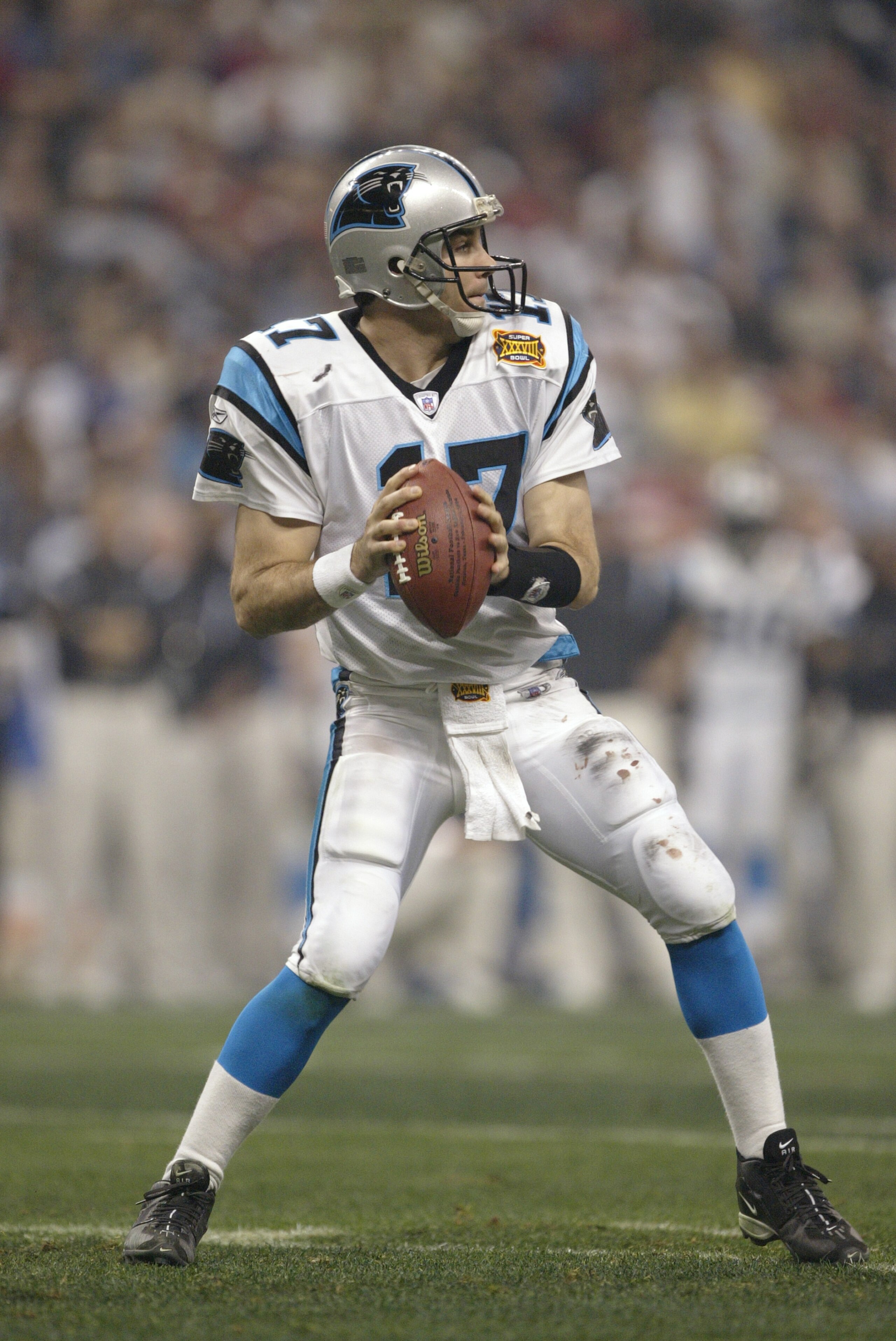 HOUSTON - FEBRUARY 1:  Quarterback Jake Delhomme #17 of the Carolina Panthers drops back to pass the ball against the New England Patriots during Super Bowl XXXVIII at Reliant Stadium on February 1, 2004 in Houston, Texas.  The Patriots defeated the Panth