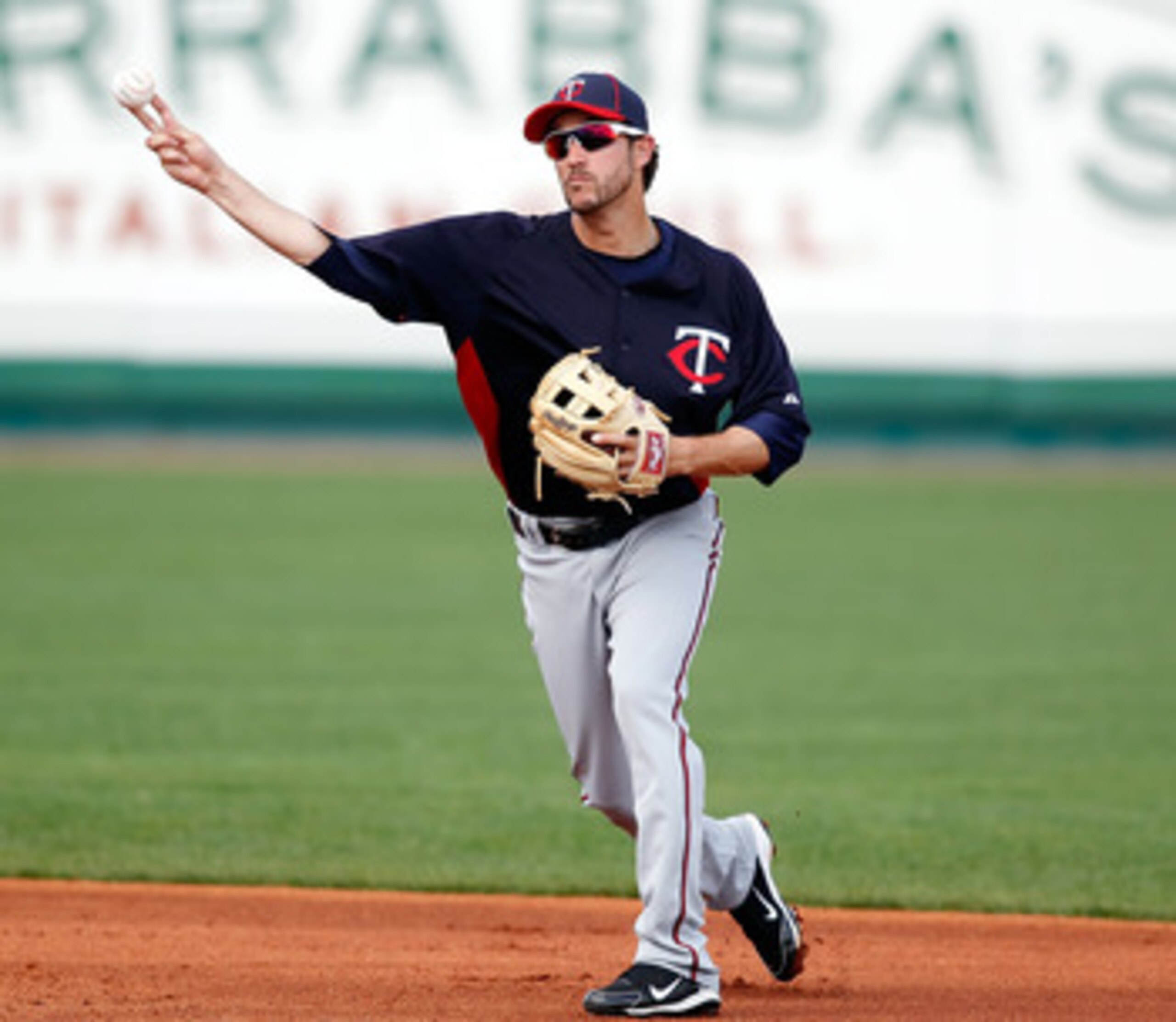 BRADENTON, FL - MARCH 02:  Shortstop Trevor Plouffe #24 of the Minnesota Twins throws over to first for an out against the Pittsburgh Pirates during a Grapefruit League Spring Training Game at McKechnie Field on March 2, 2011 in Bradenton, Florida.  (Phot