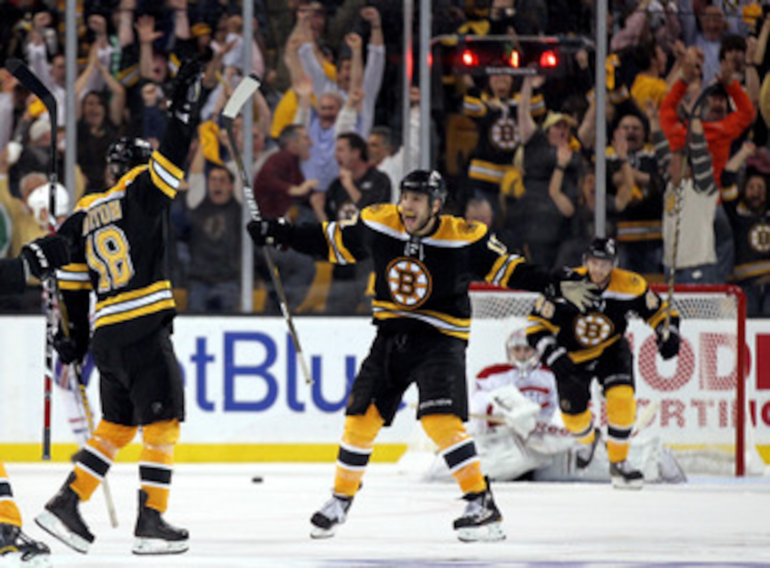 BOSTON, MA - APRIL 27: Nathan Horton #18 of the Boston Bruins celebrates with Milan Lucic #17 after Horton scored the winning goal in overtime against the Montreal Canadiens in Game Seven of the Eastern Conference Quarterfinals during the 2011 NHL Stanley