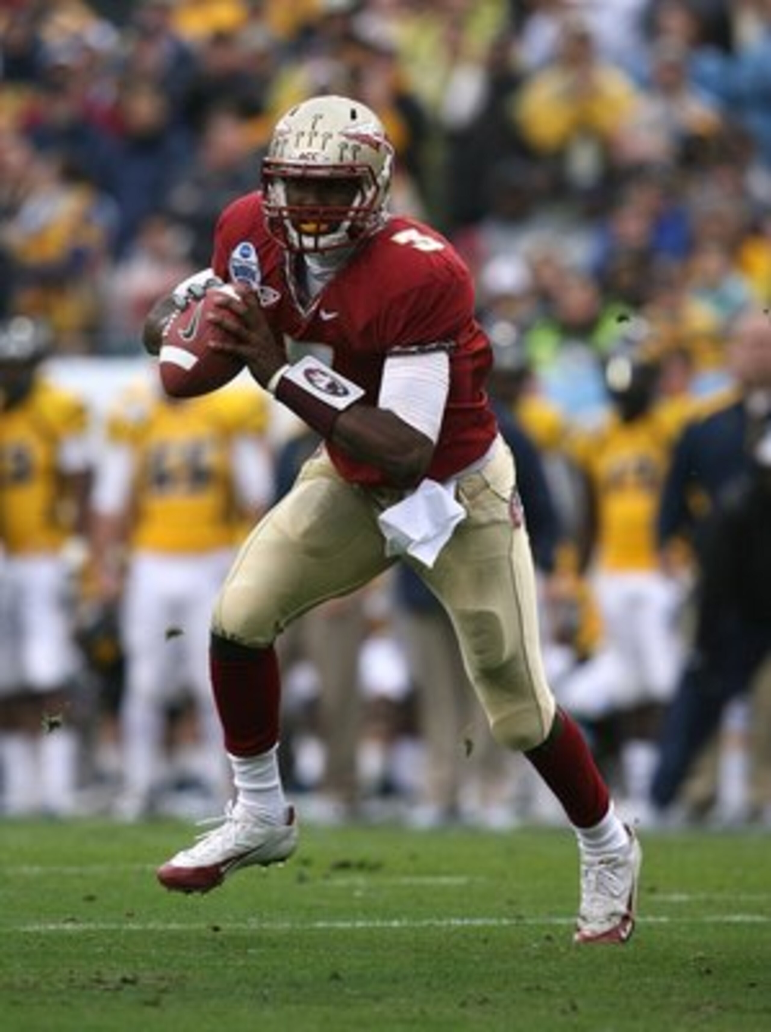 JACKSONVILLE, FL - JANUARY 01:  Quarterback E.J. Manuel #3 of the Florida State Seminoles scrambles against the West Virginia Mountaineers during the Konica Minolta Gator Bowl on January 1, 2010 at Jacksonville Municipal Stadium in Jacksonville, Florida. 