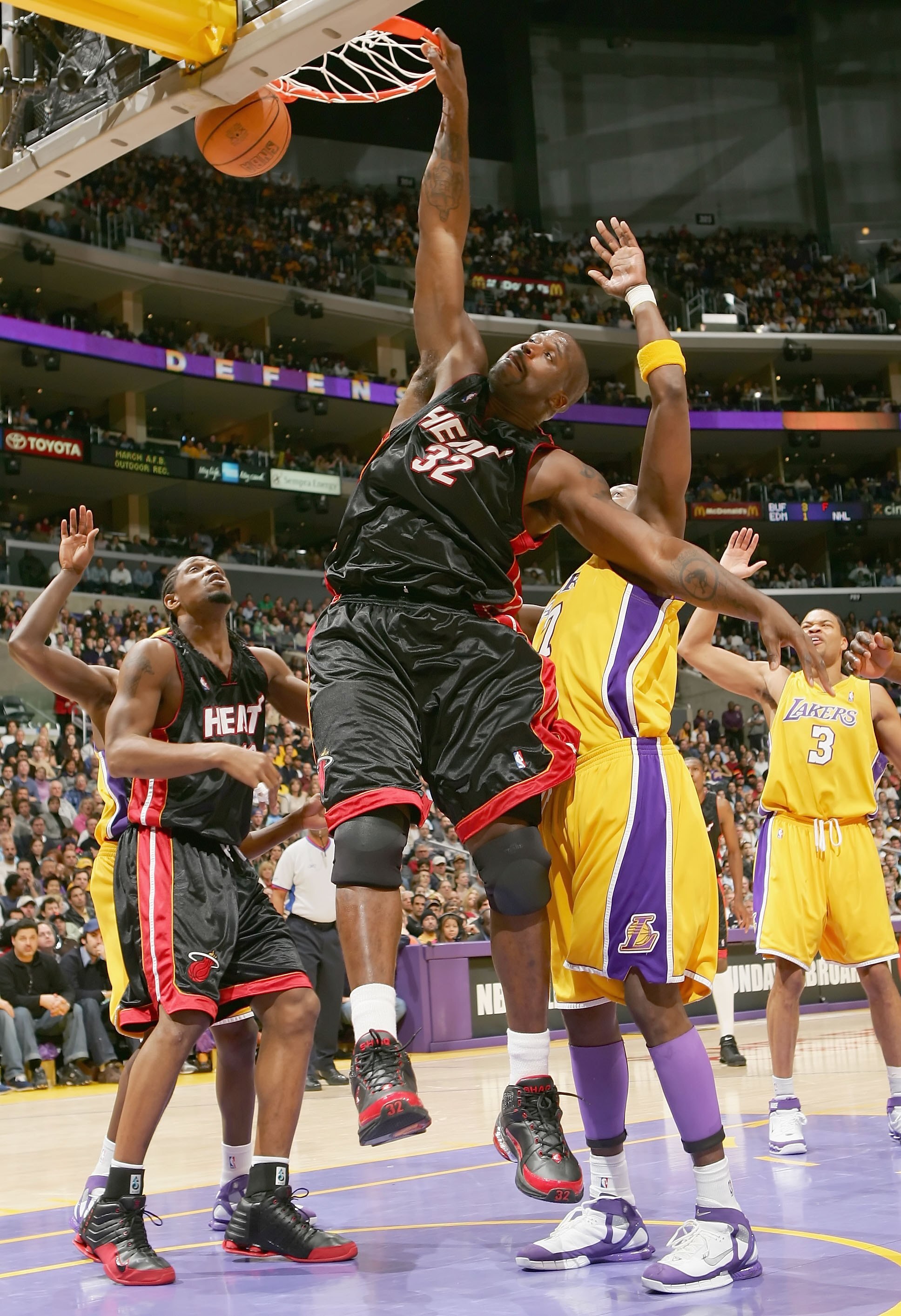LOS ANGELES - JANUARY 16: Shaquille O'Neal #32  of the Miami Heat slam dunks against the Los Angeles Lakers on January 16, 2006 at Staples Center in Los Angeles, California. NOTE TO USER: User expressly acknowledges and agrees that, by downloading and or