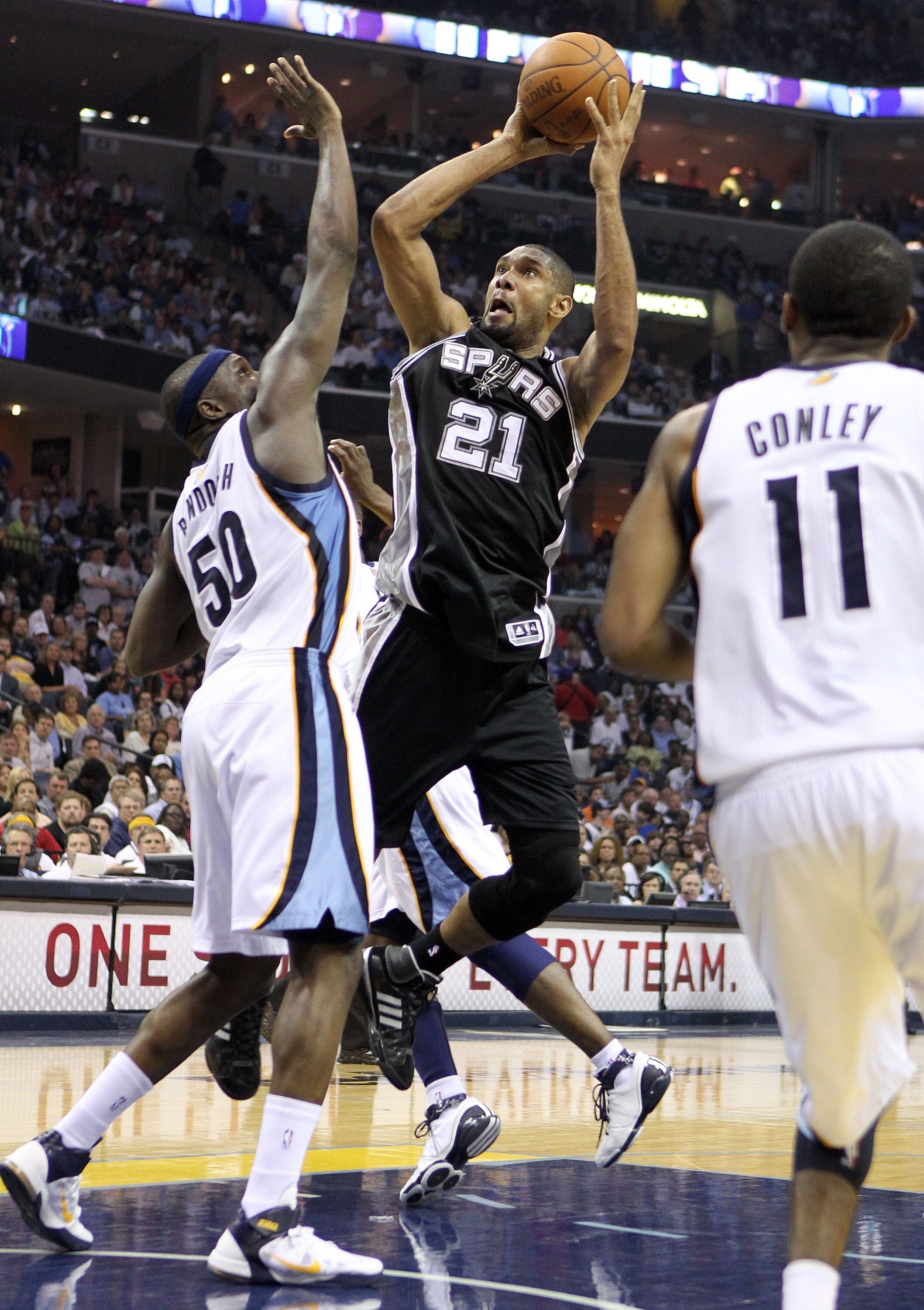 MEMPHIS, TN - APRIL 25:  Tim Duncan #21 of the San Antonio Spurs shoots the ball while defended by Zach Randolph #50 of the Memphis Grizzlies in Game Four of the Western Conference Quarterfinals in the 2011 NBA Playoffs at FedExForum on April 25, 2011 in