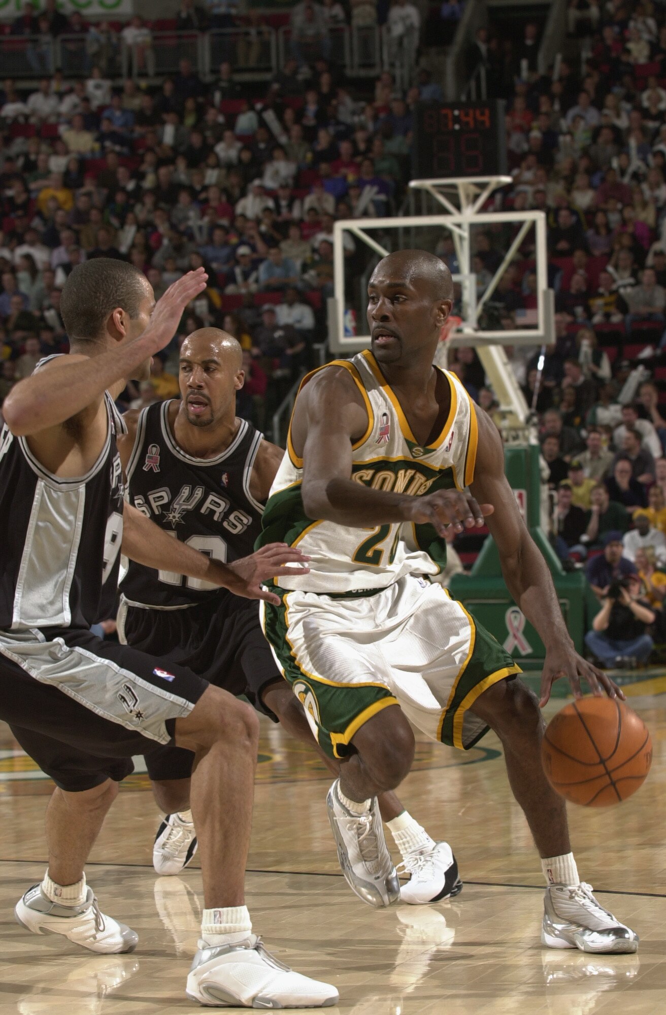 SEATTLE - MAY 1:  Point guard Gary Payton #20 of the Seattle SuperSonics drives past point guard Tony Parker #9 of the San Antonio Spurs during game four of the Western Conference Quarterfinals during the 2002 NBA Playoffs at Key Arena in Seattle, Washing