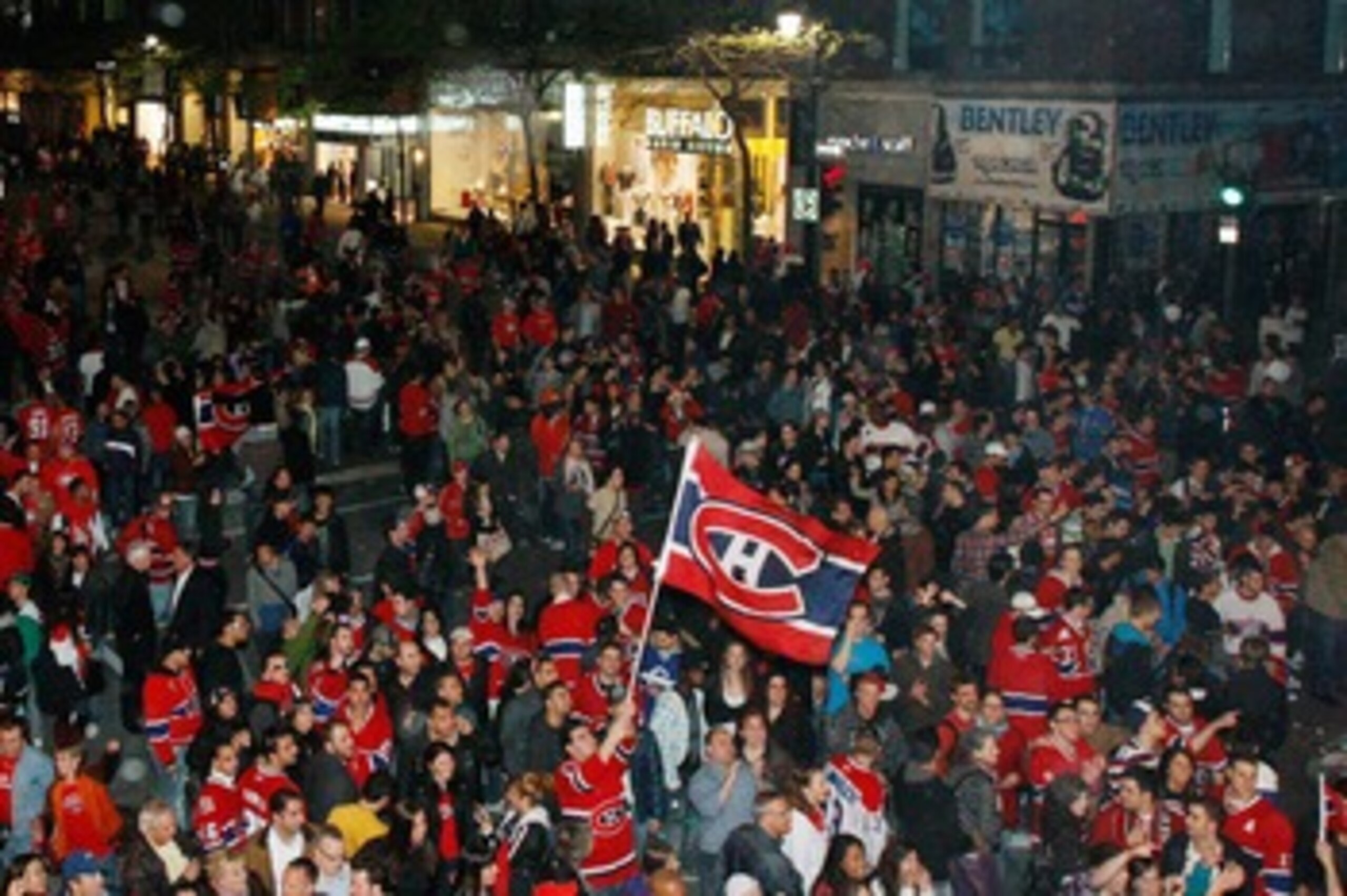 MONTREAL- MAY 12:   Canadiens fans celebrate in the streets of downtown Montreal after the Montreal Canadiens defeated the Pittsburgh Penguins in Game Seven of the Eastern Conference Semifinals during the 2010 NHL Stanley Cup Playoffs at the Bell Centre o
