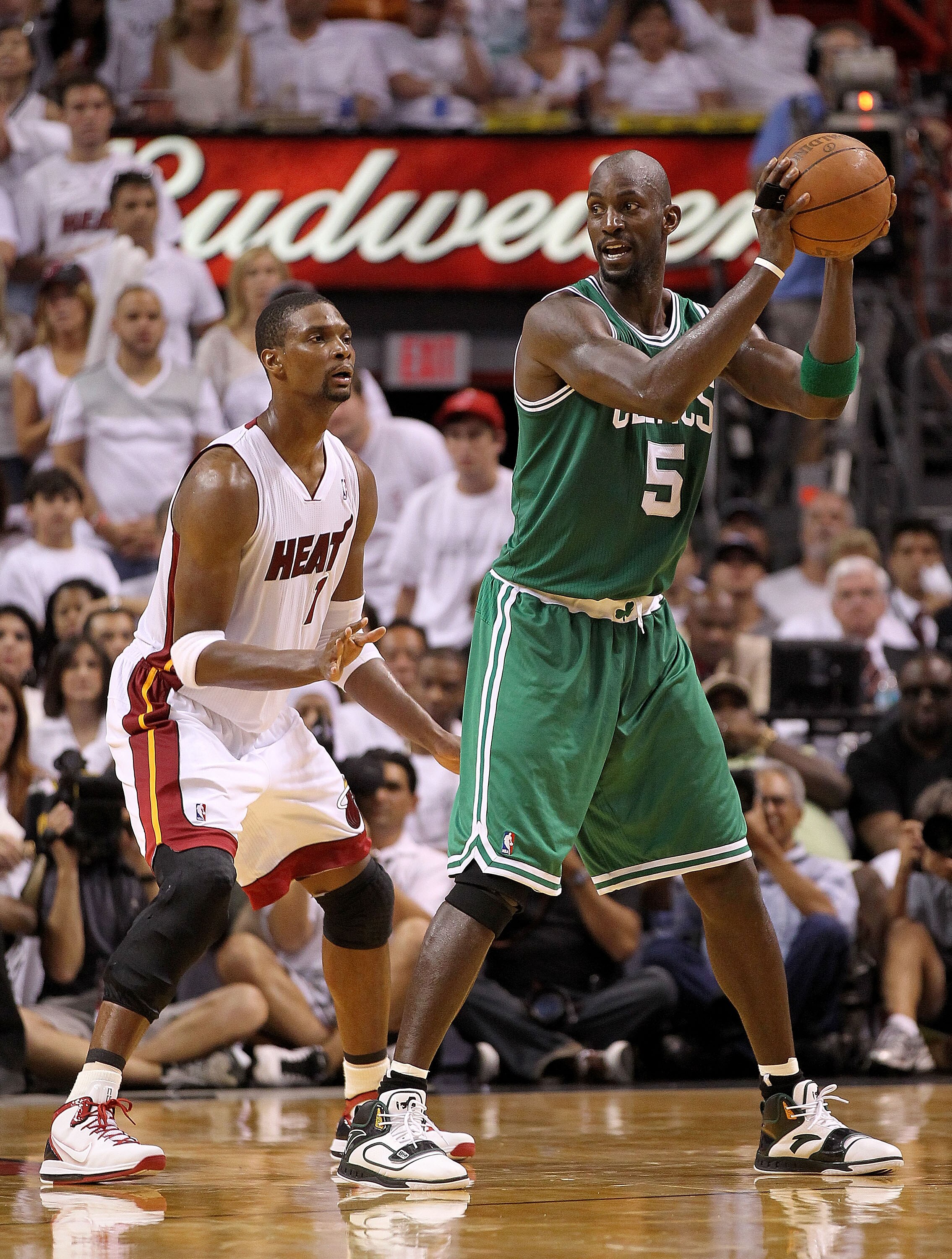 MIAMI, FL - MAY 01:  Kevin Garnett #5  of the Boston Celtics posts up Chris Bosh #1 of the Miami Heat during game one of the Eastern Conference Semifinals of the 2011 NBA Playoffs at American Airlines Arena on May 1, 2011 in Miami, Florida. NOTE TO USER: