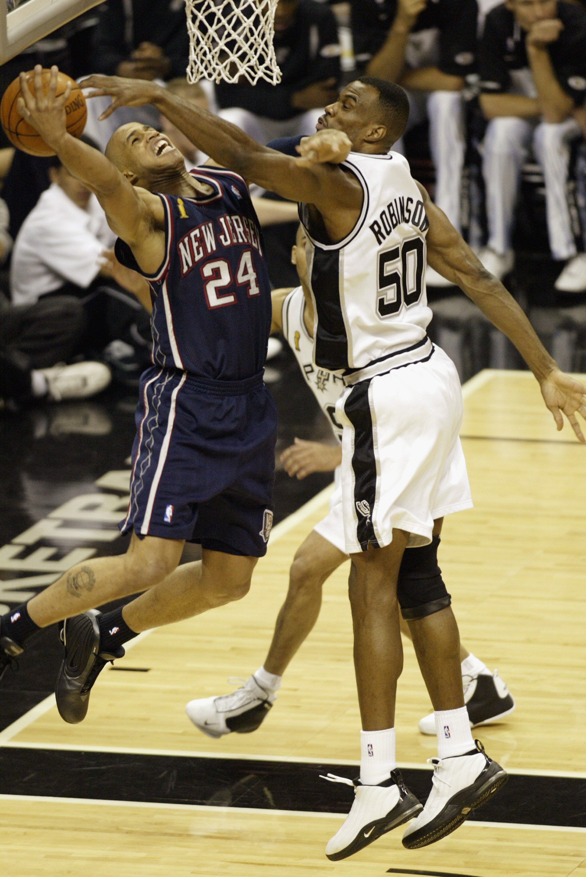 SAN ANTONIO - JUNE 6:  Richard Jefferson #24 of the New Jersey Nets shoots against the David Robinson #50 of the San Antonio Spurs during Game two of the 2003 NBA Finals at SBC Center on June 6, 2003 in San Antonio, Texas.  The Nets won 87-85.  NOTE TO US