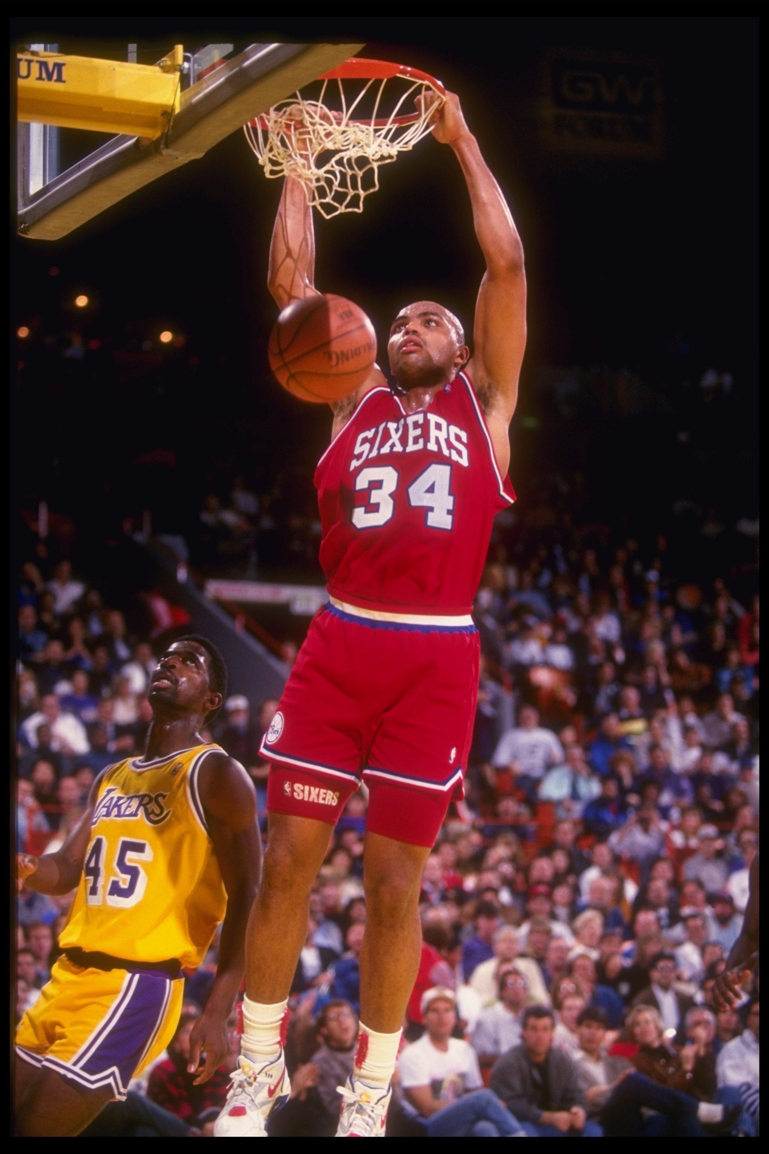 30 Dec 1990: Forward Charles Barkley of the Philadelphia 76ers sinks the ball during a game against the Los Angeles Lakers at the CoreStates Spectrum in Inglewood, California. The Lakers won the game, 115-107.