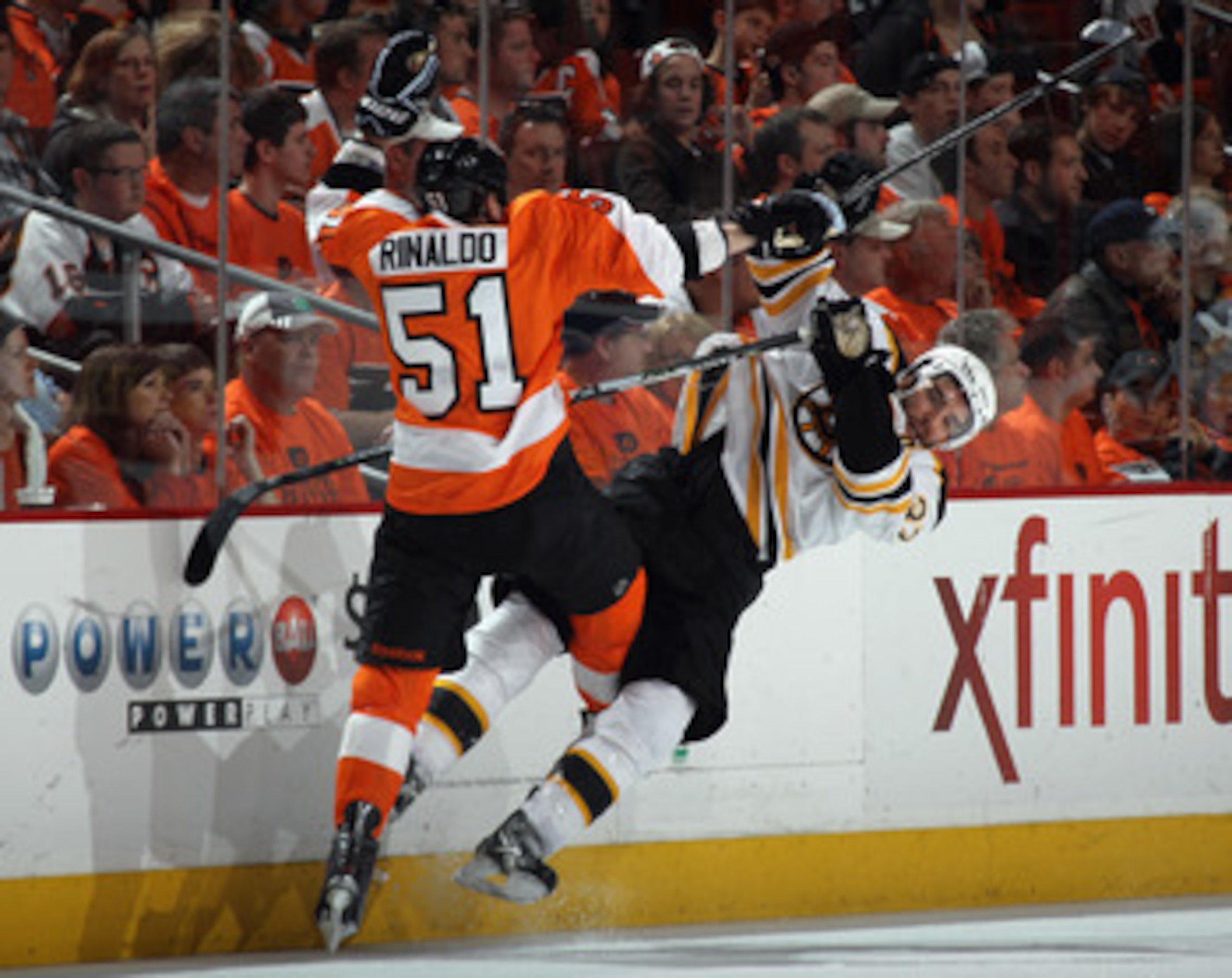 PHILADELPHIA, PA - APRIL 30: Zac Rinaldo #51 of the Philadelphia Flyers hits Patrice Bergeron #37 of the Boston Bruins in Game One of the Eastern Conference Semifinals during the 2011 NHL Stanley Cup Playoffs at the Wells Fargo Center on April 30, 2011 in