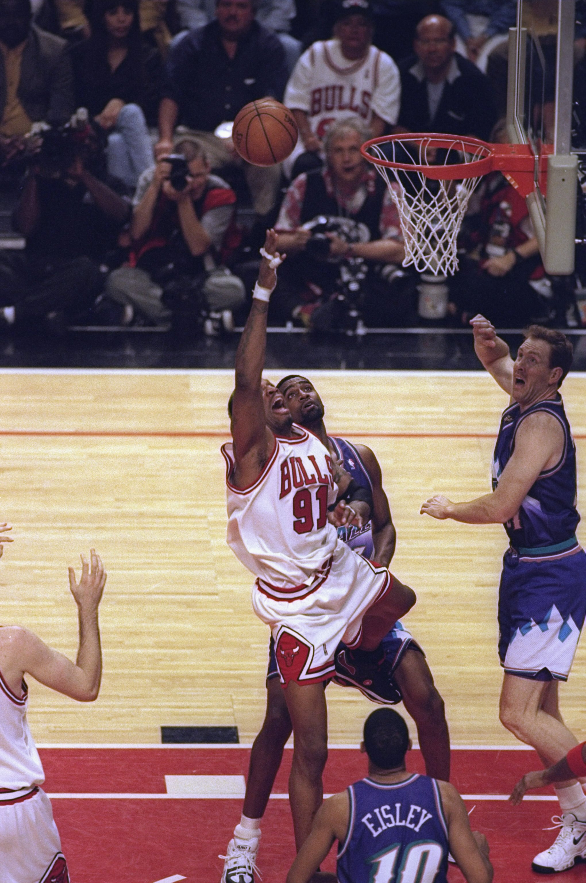 7 Jun 1998:  Dennis Rodman #91 of the Chicago Bulls goes for the rebound as Adam Keefe #31 of the Utah Jazz watches during the NBA Finals game 3 at the United Center in Chicago, Illinois.  The Bulls defeated the Jazz 96-54. Mandatory Credit: Jonathan Dani