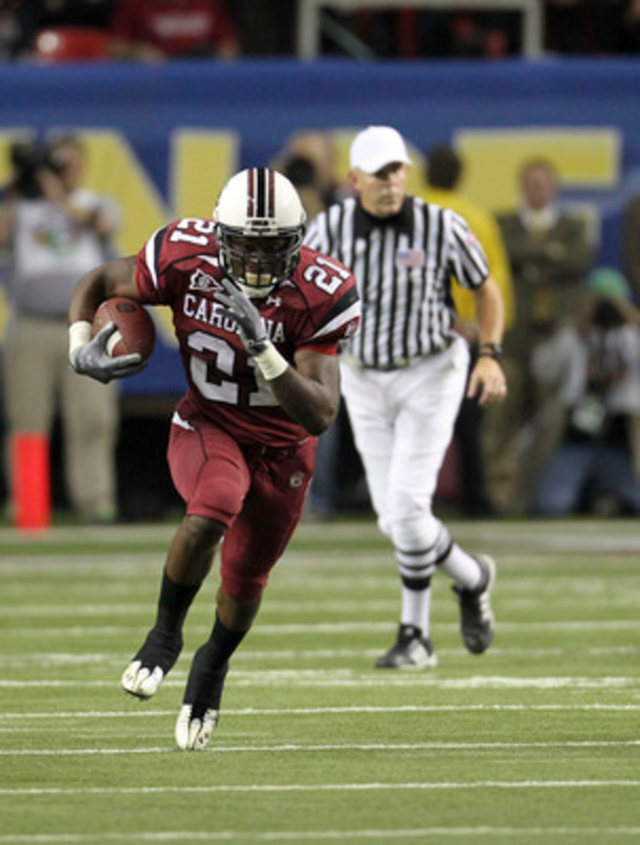 ATLANTA - DECEMBER 4: Running back Marcus Lattimore #21 of the South Carolina Gamecocks runs with the ball during the 2010 SEC Championship against the Auburn Tigers at Georgia Dome on December 4, 2010 in Atlanta, Georgia. (Photo by Mike Zarrilli/Getty I ATLANTA - DECEMBER 4: Running back Marcus Lattimore #21 of the South Carolina Gamecocks runs with the ball during the 2010 SEC Championship against the Auburn Tigers at Georgia Dome on December 4, 2010 in Atlanta, Georgia. (Photo by Mike Zarrilli/Getty I