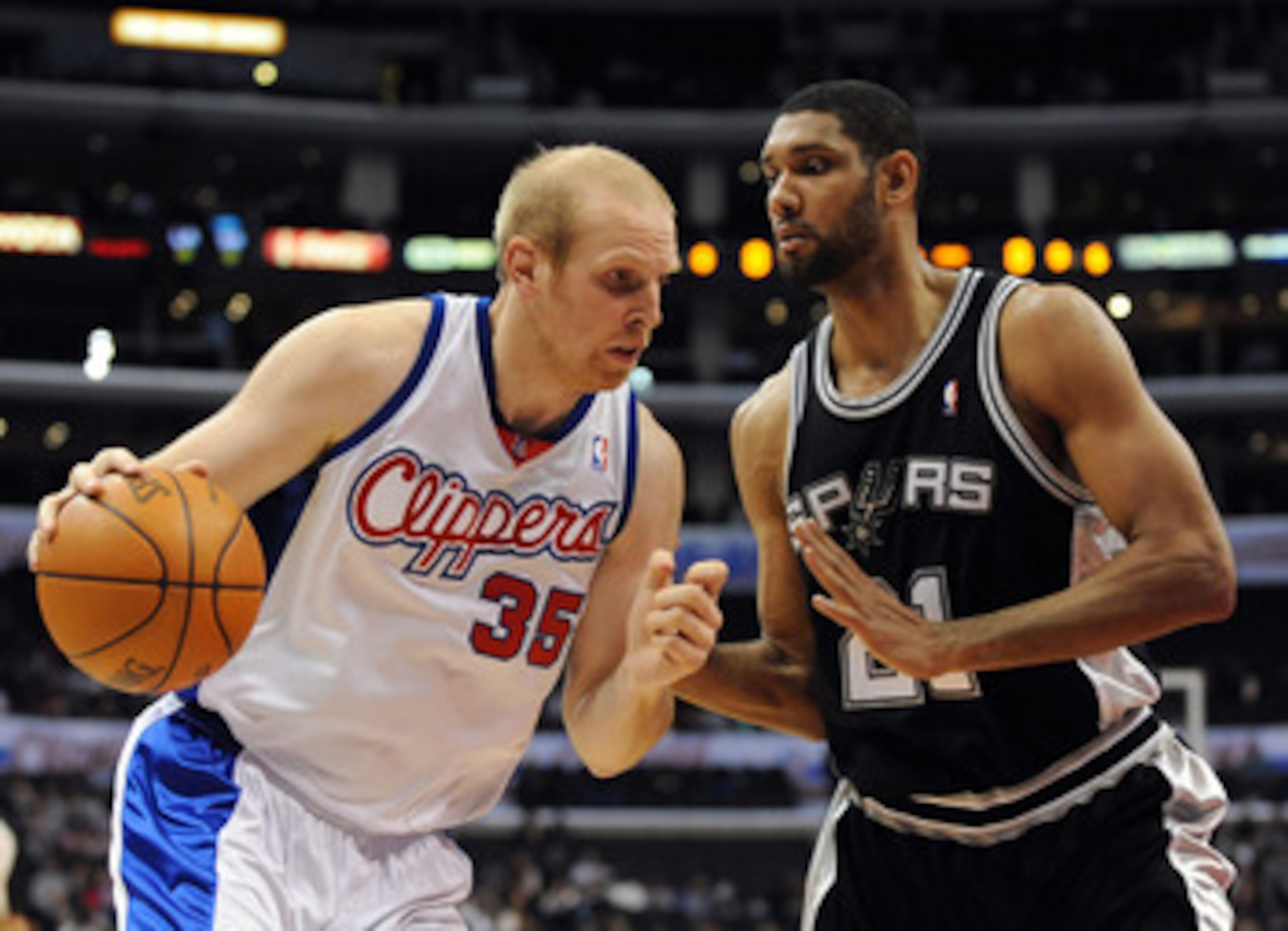 LOS ANGELES, CA - DECEMBER 13:  Chris Kaman #35 of the Los Angeles Clippers dribbles to the basket in front of Tim Duncan #21 of the San Antonio Spurs at Staples Center on December 13, 2009 in Los Angeles, California.  NOTE TO USER: User expressly acknowl