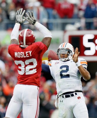 TUSCALOOSA, AL - NOVEMBER 26:  Quarterback Cam Newton #2 of the Auburn Tigers is pressured on the touchdown pass by C.J. Mosley #32 of the Alabama Crimson Tide at Bryant-Denny Stadium on November 26, 2010 in Tuscaloosa, Alabama.  (Photo by Kevin C. Cox/Ge