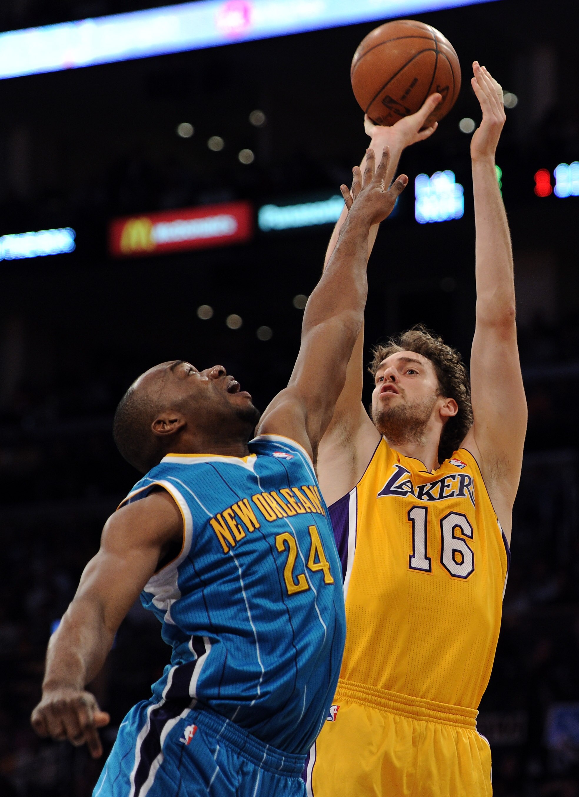 LOS ANGELES, CA - APRIL 26:  Pau Gasol #16 of the Los Angeles Lakers shoots over Carl Landry #24 of the New Orleans Hornets in the first quarter in Game Five of the Western Conference Quarterfinals in the 2011 NBA Playoffs on April 26, 2011 at Staples Cen